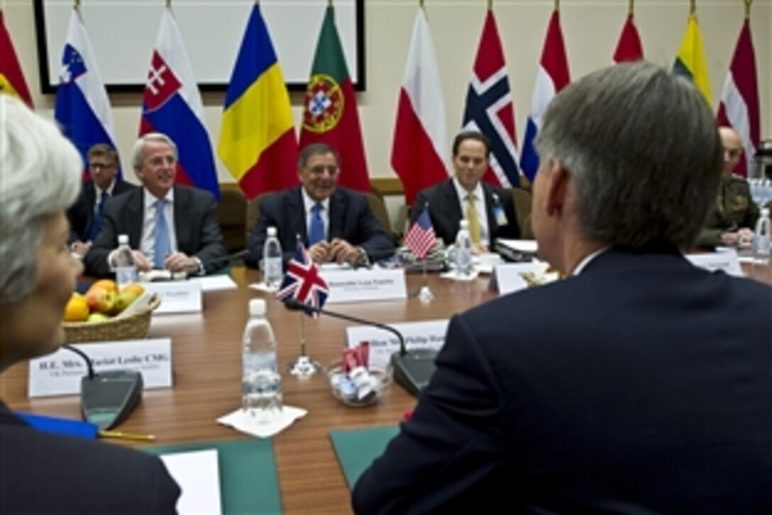 U.S. Defense Secretary Leon E. Panetta meets with British Defense Secretary Philip Hammond before the first meetings of the NATO defense ministers and members of the North Atlantic Council in Brussels, Oct. 8, 2012. 