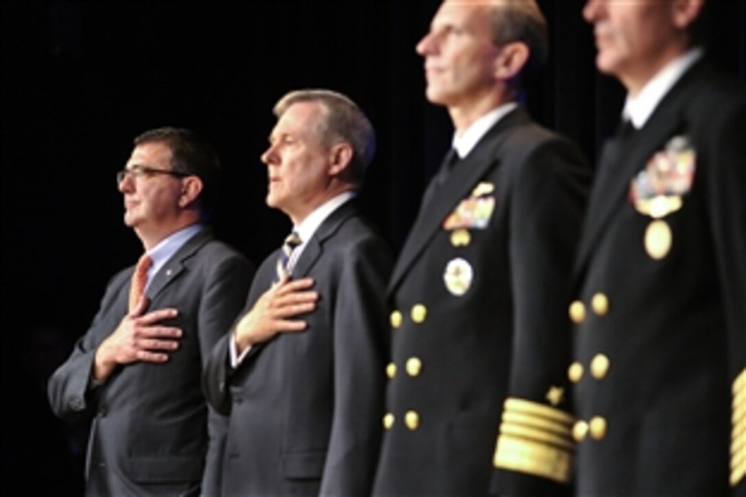 Deputy Defense Secretary Ashton B. Carter, left,  and Navy Secretary Ray Mabus stand as the national anthem plays during the Navy's 237th birthday celebration at the Pentagon, Oct. 9, 2012.
