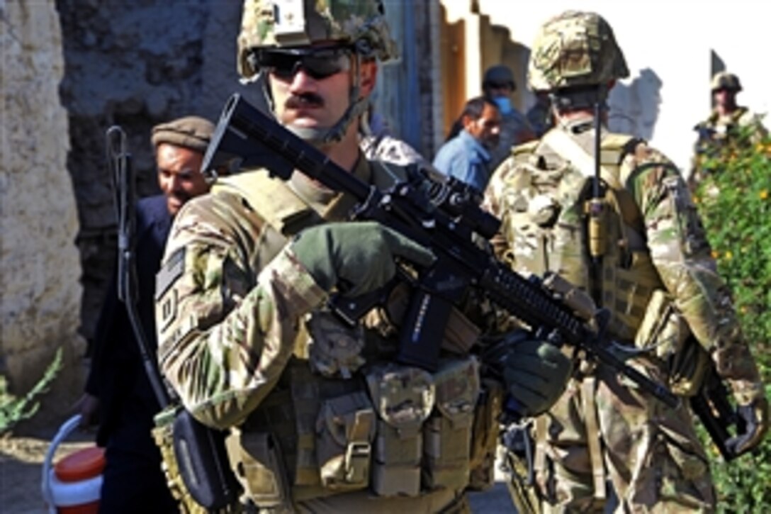 U.S. Navy Lt. Collin Korenek, front, provides security during a key leader engagement with district leaders in the Noorgul district center in Afghanistan's Kunar province, Oct. 1, 2012. Korenek is assigned to Provincial Reconstruction Team Kunar. 