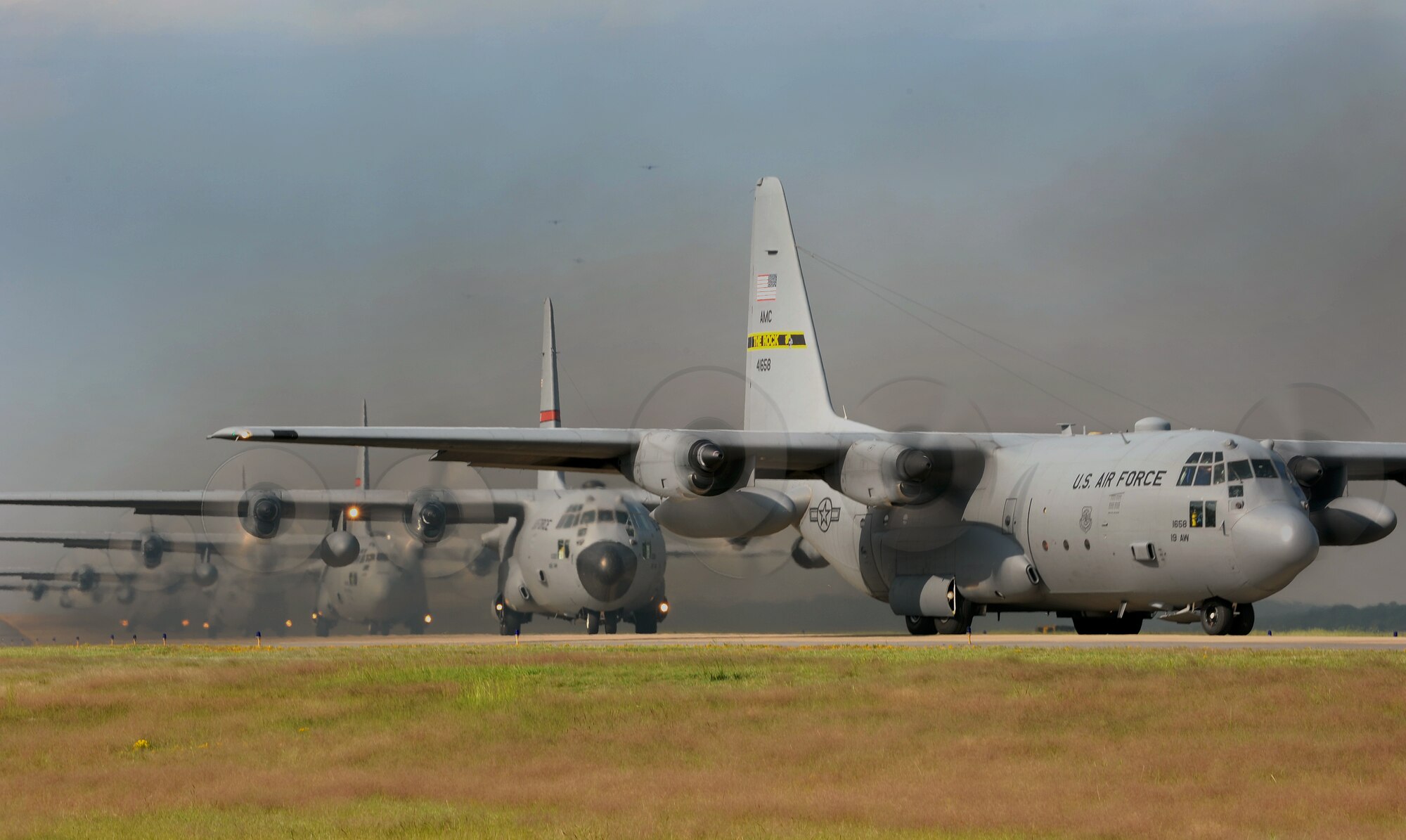 C-130s line the runway before a flight Oct. 3, 2012, at Little Rock Air Force Base, Ark. The aircraft were part of a 14-ship formation.  (U.S. Air Force photo by Staff Sgt. Jessica Condit)