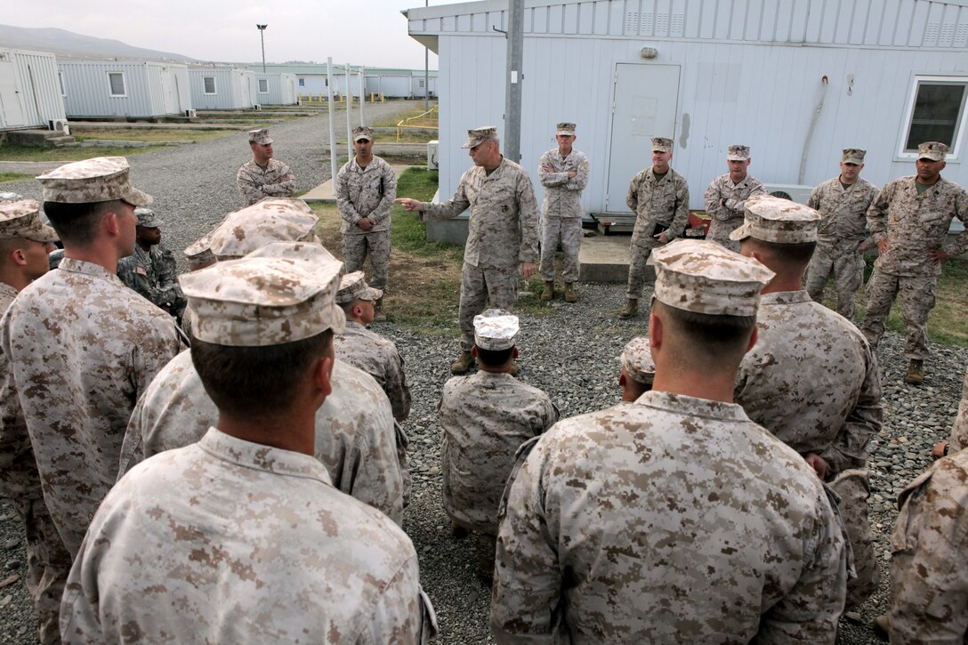 Lieutenant General John M. Paxton, Jr., commander, U.S. Marine Corps Forces Command, commander, U.S. Marine Corps Forces, Europe talks to Marines, soldiers and a sailor at a training area during a recent visit to Tbilisi, Georgia,  the U.S. Embassy and meetings with Georgian political leaders and Georgian Armed Forces leaders. The Marine Corps works in partnership with the Georgian Armed Forces to ensure regional stability and to strengthen military interoperability. The Georgian Deployment Program, started in 2009, is a Marine Forces Europe initiative to help the Georgian Armed Forces, train, deploy and support the International Security Assitance Force (ISAF) and NATO missions in Overseas Contingency Operations.

