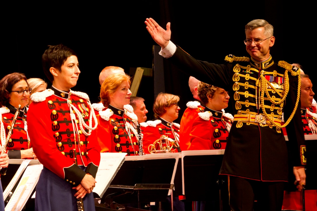 Colonel Michael J. Colburn, the director of The President's Own United States Marine Band, accepts applause during a concert performance at Hollidaysburg Senior High School Oct. 4. The concert was part of a month-long band tour throughout the Northeastern United States and one of three shows in Pennsylvania. (US Marine Corps photo by Staff Sgt. Jeffery Cosola)



