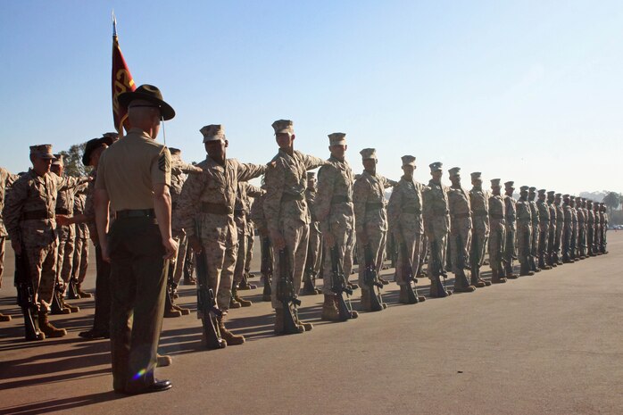 Staff Sgt. Jerry Duncan, senior drill instructor, of Company A, 1st Recruit Training Battalion, inspects his platoon's alignment during Final Drill aboard Marine Recruit Depot San Diego Oct. 1.