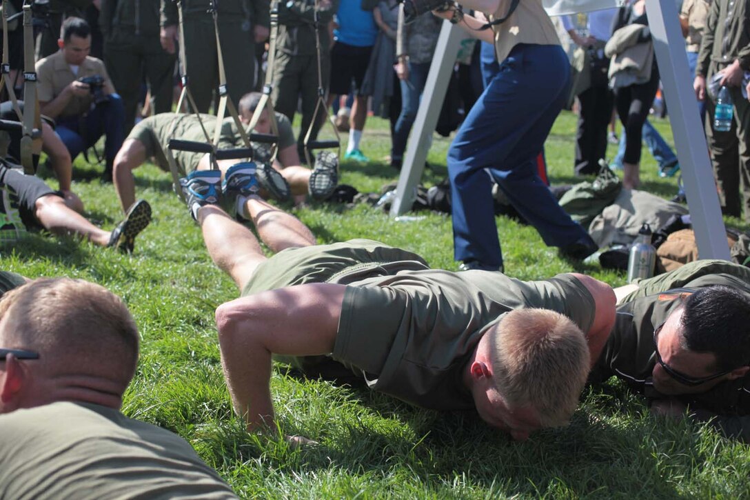 Capt. James Weathers with the 13th Marine Expeditionary Unit, does pike pushups while competing at the TRX workout competition between the Marine Corps, Navy, and Coast Guard on Marina Green, Oct. 6, during the San Francisco Fleet Week 2012. More than 800 Marines and sailors from 1st Marine Expeditionary Brigade, Combat Logistics Regiment 1 and the 13th Marine Expeditionary Unit will participate in the annual event from Oct. 3-8 and will showcase humanitarian assistance and disaster relief capabilities to the Bay Area.