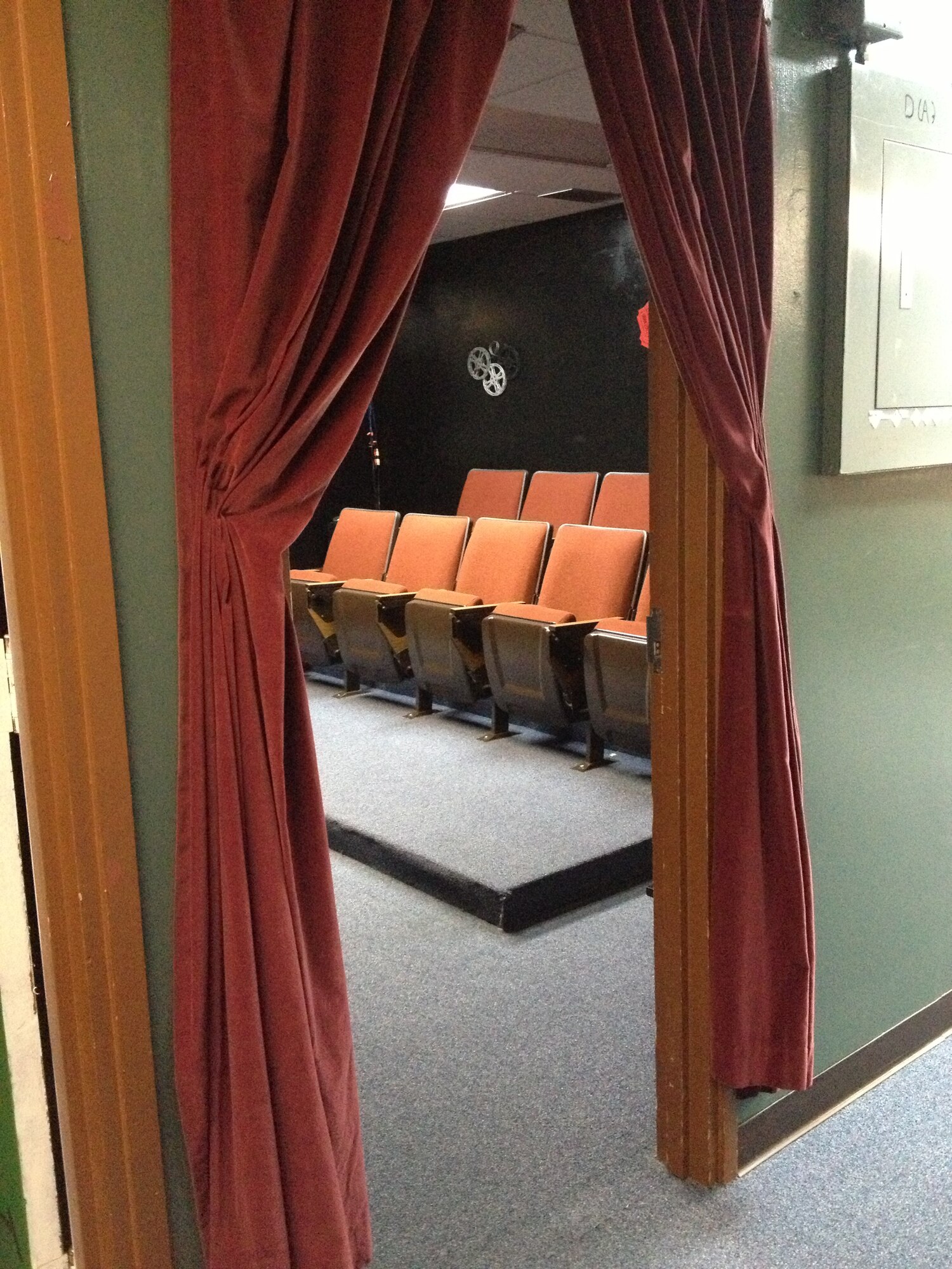 A new theater was formally unveiled during a ribbon cutting ceremony at the Wired Bean on Oct. 10, 2012. The event also celebrated the newly remodeled kitchen which provides Kadena's junior enlisted servicemembers a place to cook meals. (U.S. Air Force photo/Senior Master Sgt. J.C. Woodring)