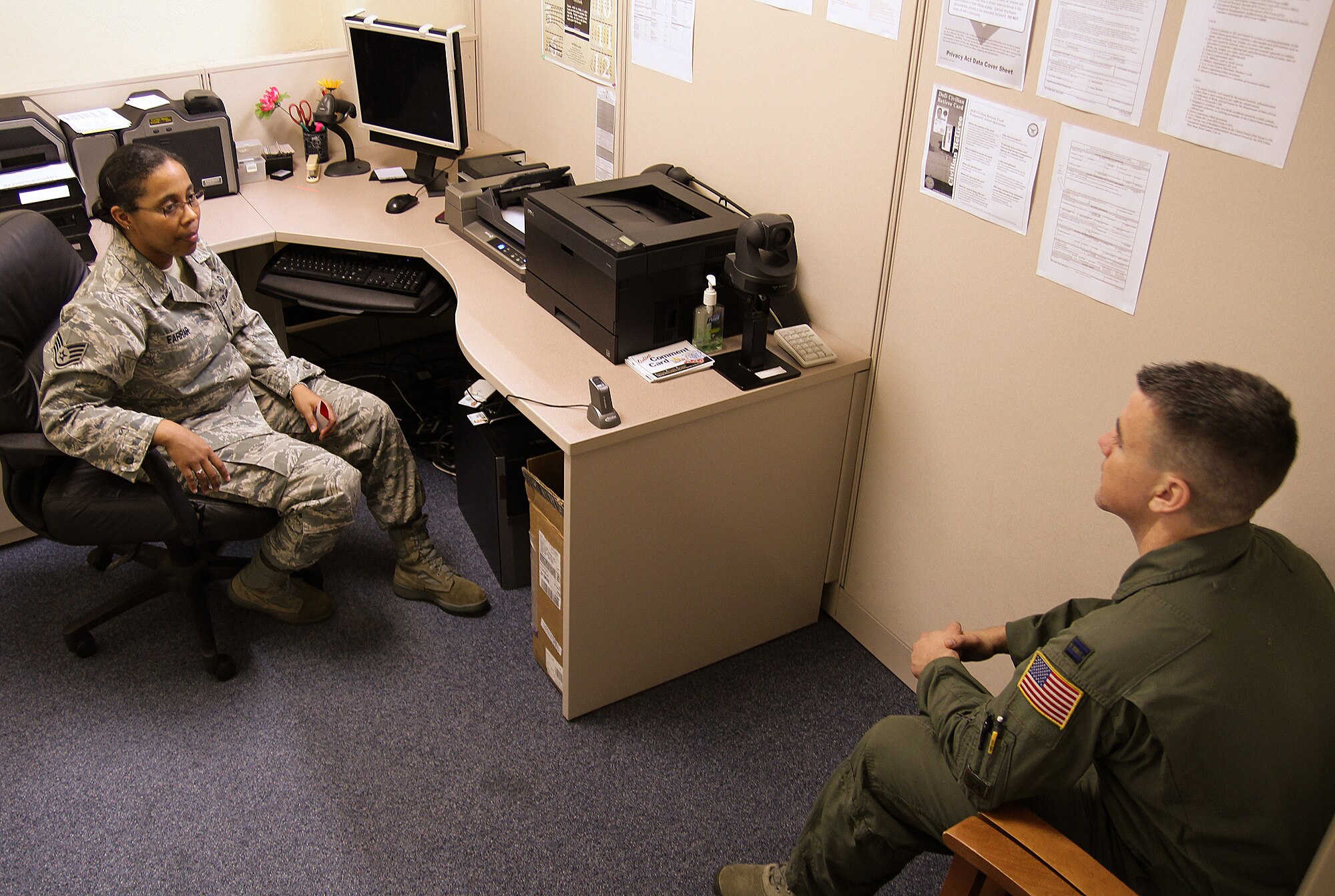 Staff Sgt. April Farrar, 18th Forces Support Squadron assistant NCO in charge of military personnel section customer service, discusses career options with an MPS customer on Kadena Air Base, Japan, Oct. 10, 2012. Every second and fourth Wednesday of the month, the MPS offers walk-in customer service from 8 a.m. to 8 p.m. to accomodate customers with atypical work schedules. (U.S. Air Force photo/Tech. Sgt. Jason Lake)