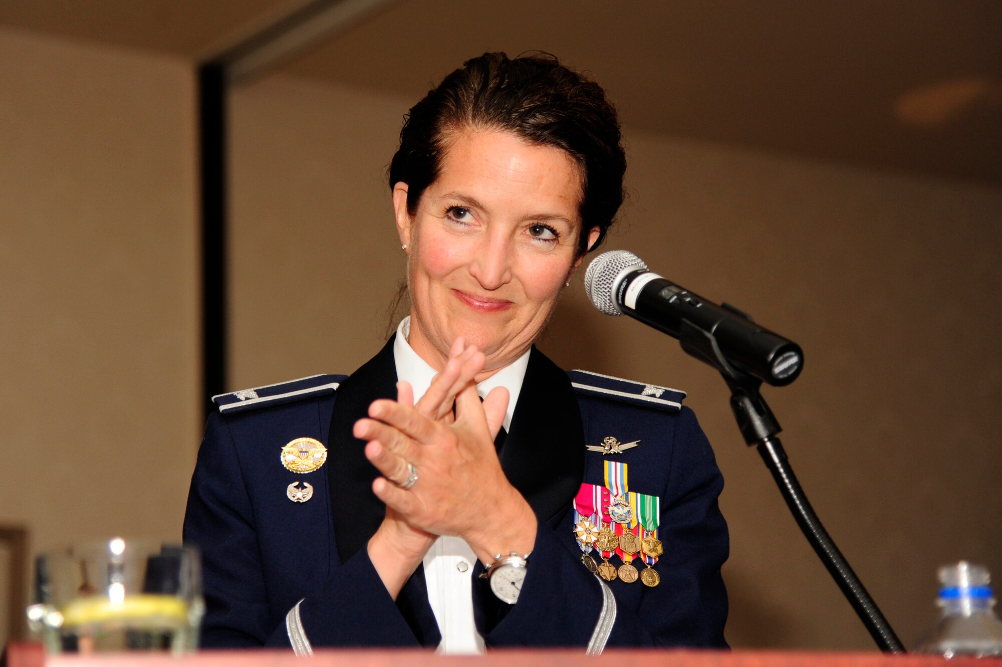 VANDENBERG AIR FORCE BASE, Calif. – Col. Nina Armagno, 30th Space Wing commander, applauds the guest speaker retired Gen. Lance W. Lord, former Air Force Space Command commander, during the Air Force Ball here Friday, Oct. 5,2012. The Air Force Ball celebrated the 65th Birthday of the Air Force and the 30th anniversary of AFSPC. (U.S. Air Force photo/Senior Airman Lael Huss)