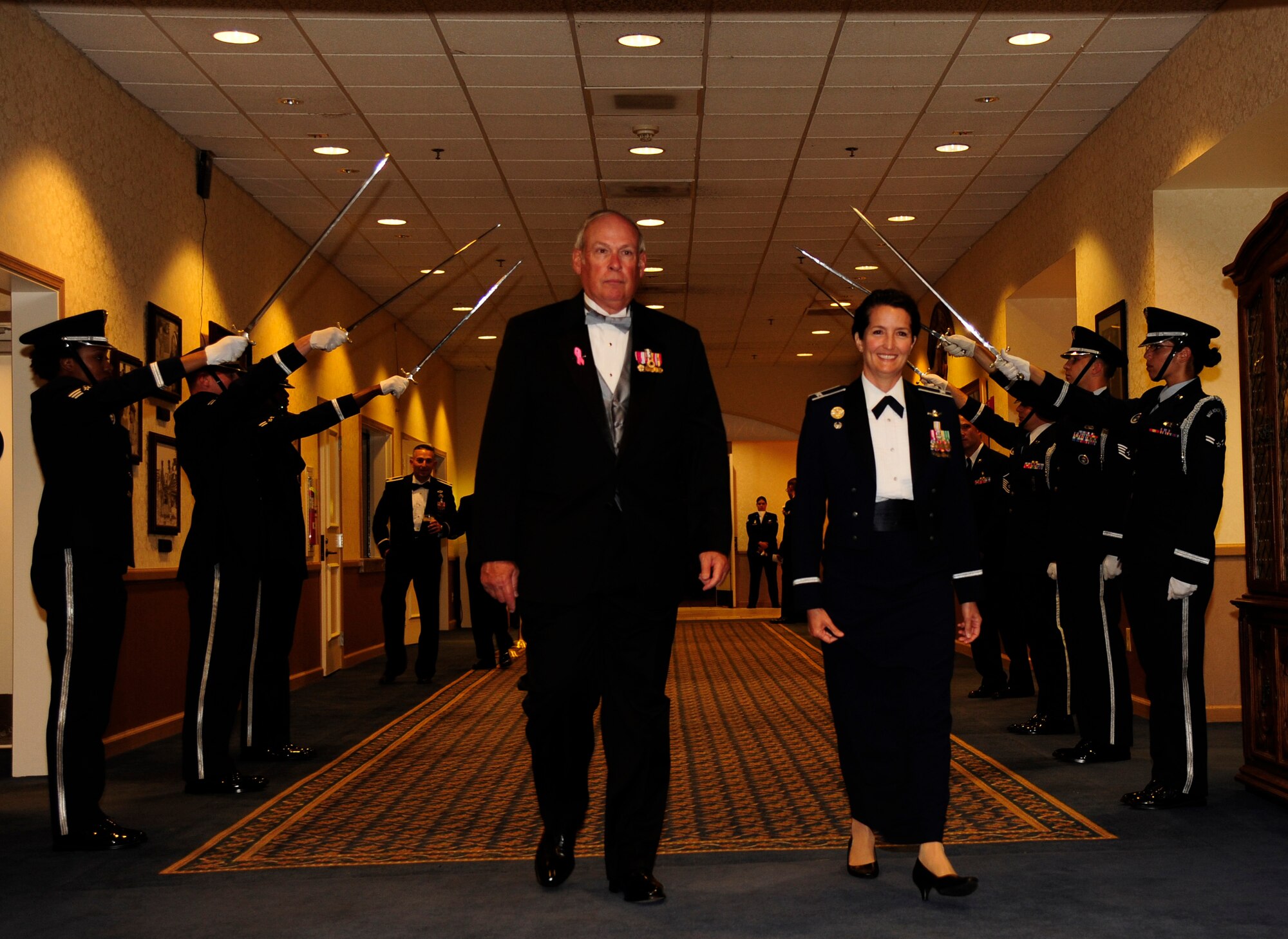 VANDENBERG AIR FORCE BASE, Calif. – Retired Gen. Lance W. Lord, former Air Force Space Command commander, walks under Vandenberg Honor Guard sabers to enter the Air Force Ball with Col. Nina Armagno, 30th Space Wing commander, at the Pacific Coast Club here Friday, Oct. 5, 2012. The Air Force Ball celebrated the 65th birthday of the Air Force and the 30th anniversary of AFSPC. (U.S. Air Force photo/Senior Airman Lael Huss)