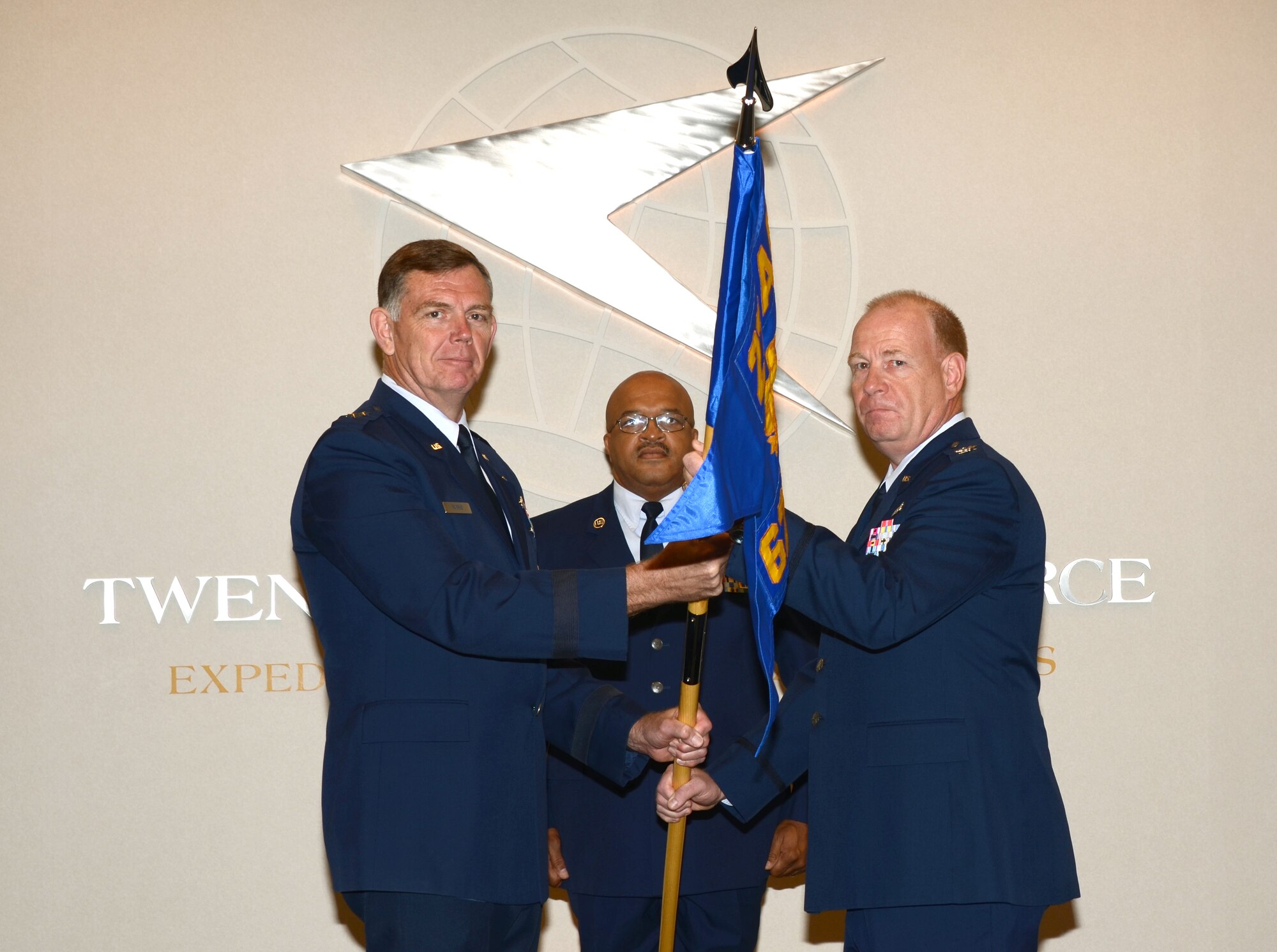 Maj. Gen. Wallace Farris Jr., 22nd Air Force commander, passes the 622nd Civil Engineering Group guidon to Col. Franklin Myers during an activation ceremony at Dobbins Air Reserve Base, Sep. 8. The newly activated group will organize six reserve RED HORSE squadrons under one unified command located at Dobbins ARB. (U.S. Air Force photo/Brad Fallin)