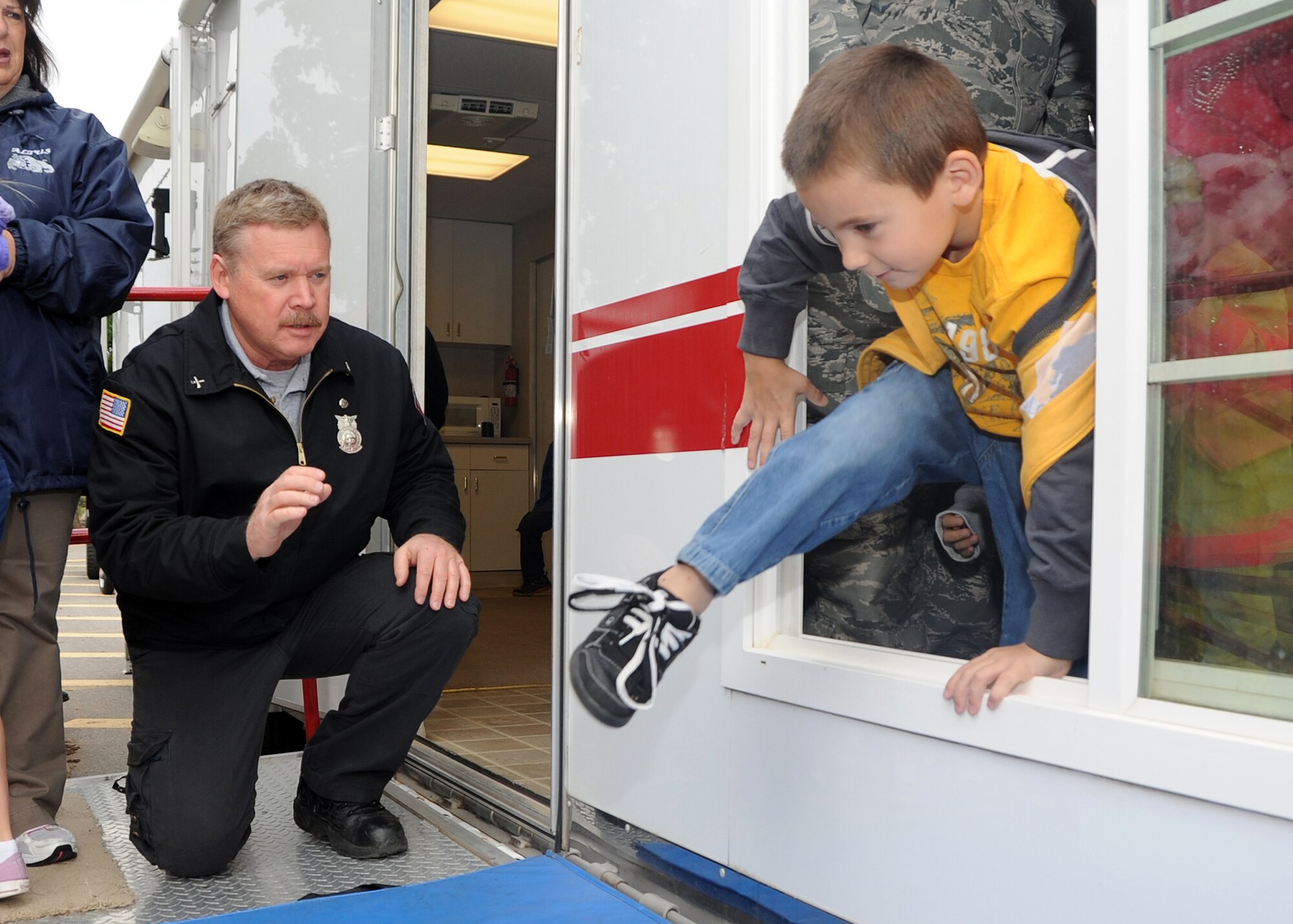 ALTUS AIR FORCE BASE, Okla. – Jeff Wilson, 97th Civil Engineer Squadron fire department inspector speaks to Lukas Decoteau while he practices escape routes at L. Mendel Rivers Elementary School, Oct. 10, 2012 during Fire Prevention Week. Lukas was practicing emergency escape routes as part of the 2012 theme, “Have 2 Ways Out!” Fire Prevention Week is held annually to promote fire safety and prevention through classes and demonstrations given throughout the base. (U.S. Air Force photo by Airman 1st Class Levin Boland / Released)