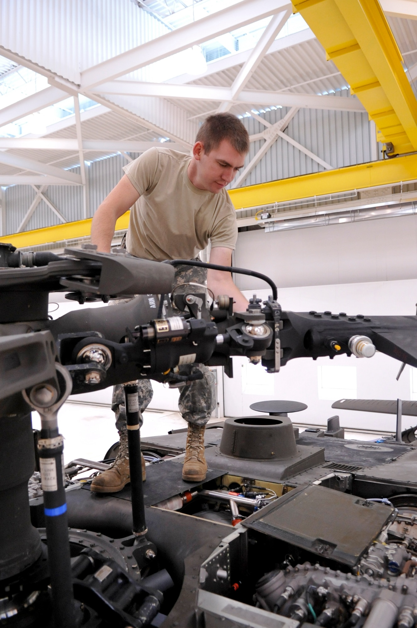 BUCKLEY AIR FORCE BASE, Colo. – Spc. Levi Davis, of Company G, 2nd Battalion, 135th General Support Aviation, performs a 90-day corrosion inspection on a UH-60 Black Hawk Oct. 4, 2012, in the Colorado Army National Guard’s Army Aviation Support Facility. Members of the AASF are responsible for ensuring the approximately 25 aircraft are mission ready. (U.S. Air Force photo by Senior Airman Christopher Gross)