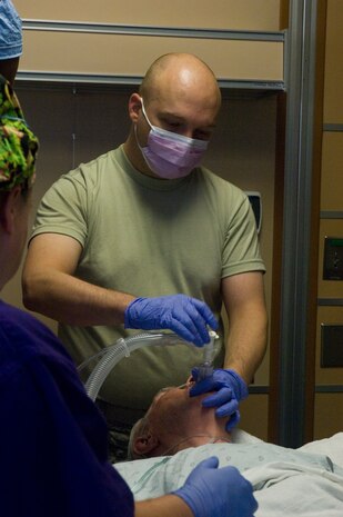 Maj. (Dr.) Jeremy Kilburn, 99th Medical Operations Squadron Cardiopulmonary Flight commander and Intensive Care Unit director, begins an Endobronchial Ultrasound Broncialscope Oct. 4, 2012, at Nellis Air Force Base, Nev. Kilburn attended a civilian fellowship where he learned and performed the procedure, which is now offered at the Mike O?Callaghan Federal Medical Center. (U.S. Air Force photo by Senior Airman Jack Sanders)