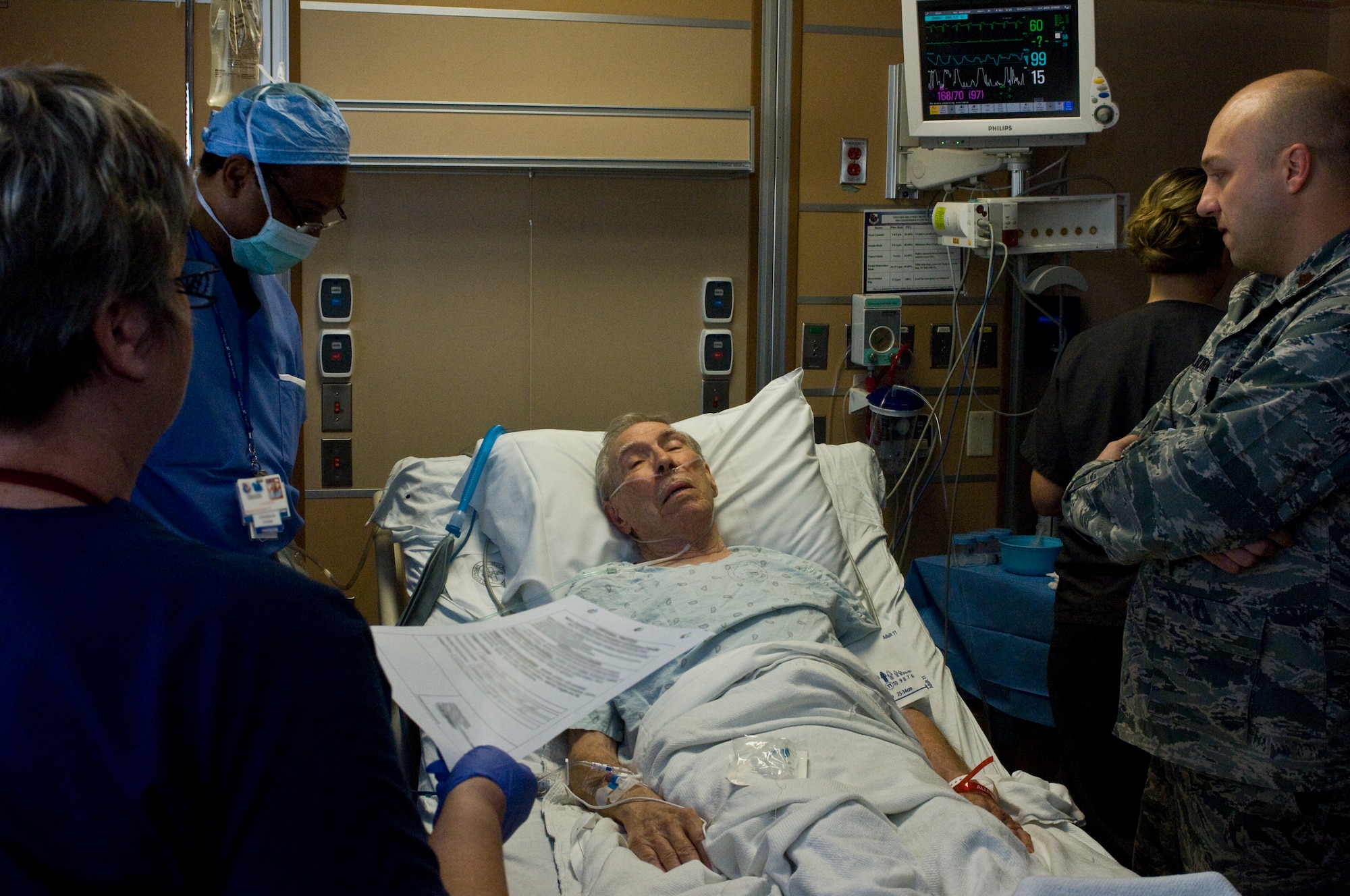 Davis Leonard, a patient at the Mike O?Callaghan Federal Medical Center, verifies his information for a pre procedure check with doctors and nursing staff Oct. 4, 2012, at Nellis Air Force Base, Nev. Leonardhad an Endobronchial Ultrasound Broncialscope done, which is one of the medical center?s newest prcedures. The procedure is less invasive than traditional surgery and can provide quicker results to patients, as well as being more cost efficient. (U.S. Air Force photo by Senior Airman Jack Sanders)
