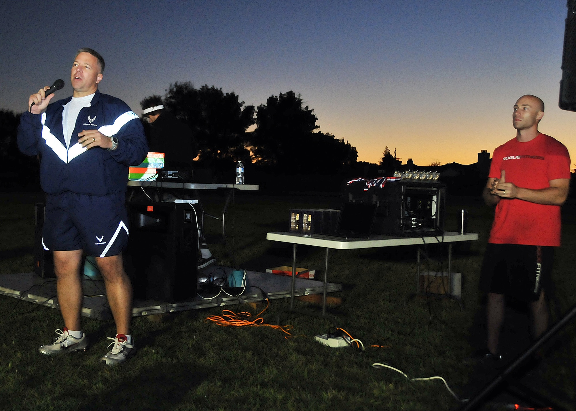 Captain Daniel McVay, co-Viking Challenge POC, looks on as Col. Darren Sprunk, 570th Contingency Response Group commander, offers closing remarks during this year's 12-hour Viking Challenge relay at GoldenWest Middle School Oct. 6.  (U.S. Air Force photo by Tech. Sgt. Lesley Waters)