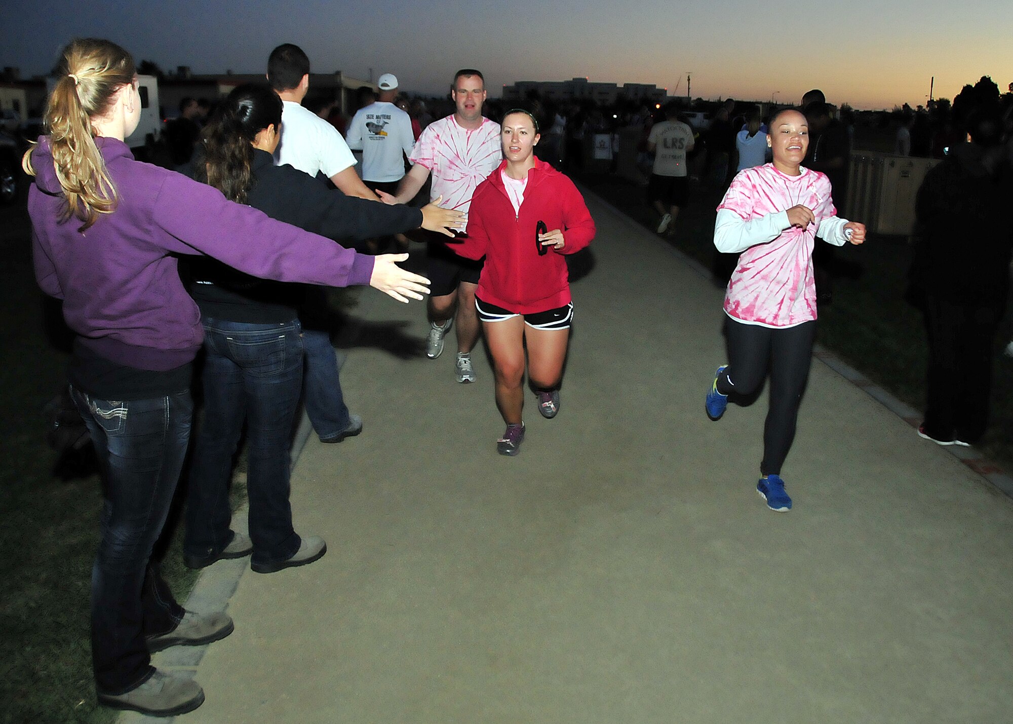 Supporters give high-fives and congratulates participants as they complete their final mile of the 12-hour Viking Challenge relay at GoldenWest Middle School Oct. 6.  (U.S. Air Force photo by Tech. Sgt. Lesley Waters)