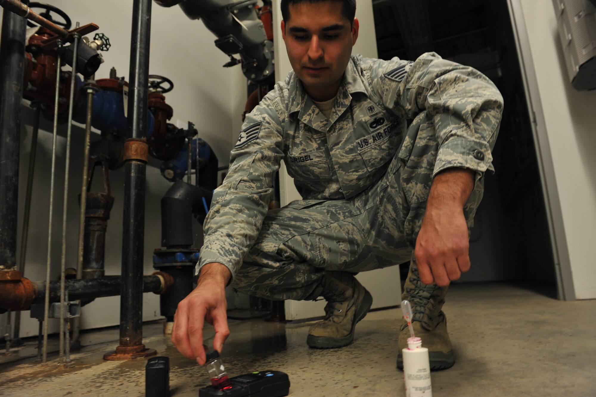 Staff Sgt. Edwin Origel, 509th Medical Operations Squadron Bioenvironmental Engineer, uses a colorimeter Oct. 3, 2012 at Whiteman Air Force Base, Mo. Bioenvironmental Engineers use the device is used to identify PH and chlorine levels in the base’s drinking water system. (U.S. Air Force photo/Heidi Hunt) (Released)