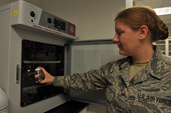 Staff Sgt. Aimee Stark, 509th Medical Operations Squadron Bioenvironmental Engineer, places media mix into incubator Oct. 3, 2012 at Whiteman Air Force Base, Mo. Bioenvironmental Engineers test for the absence of coliform bacterial or E-Coli. (U.S. Air Force photo/Heidi Hunt) (Released)