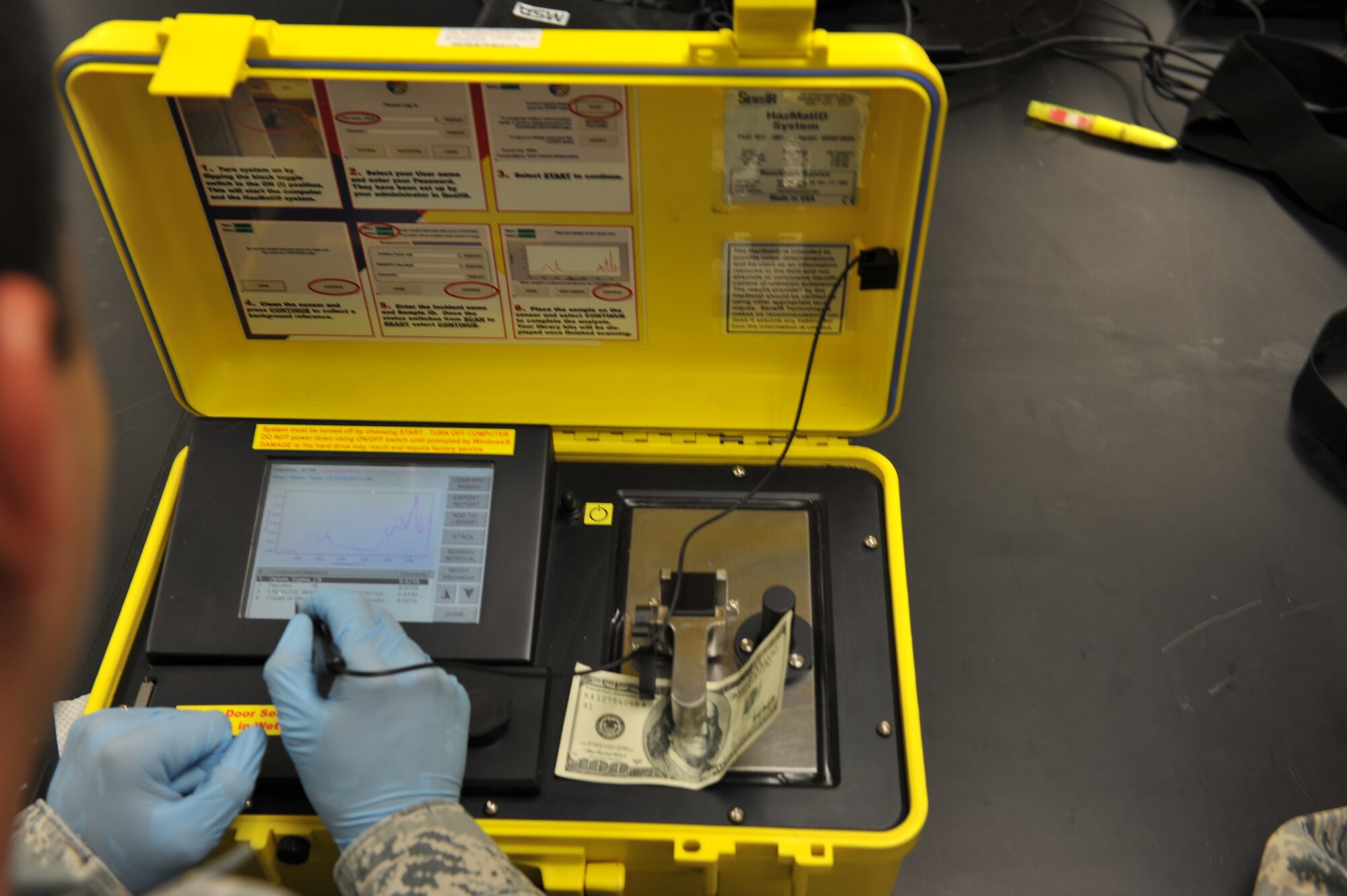 Staff Sgt. Edwin Origel, 509th Medical Operations Squadron Bioenvironmental Engineer, reads the results on a HazMatID machine during a equipment check at Whiteman Air Force Base, Mo., Oct. 3, 2012. The Bioenvironmental Flight uses the device to distinguish chemicals and check for anything that is deemed suspicious. (U.S. Air Force photo/Heidi Hunt) (Released)