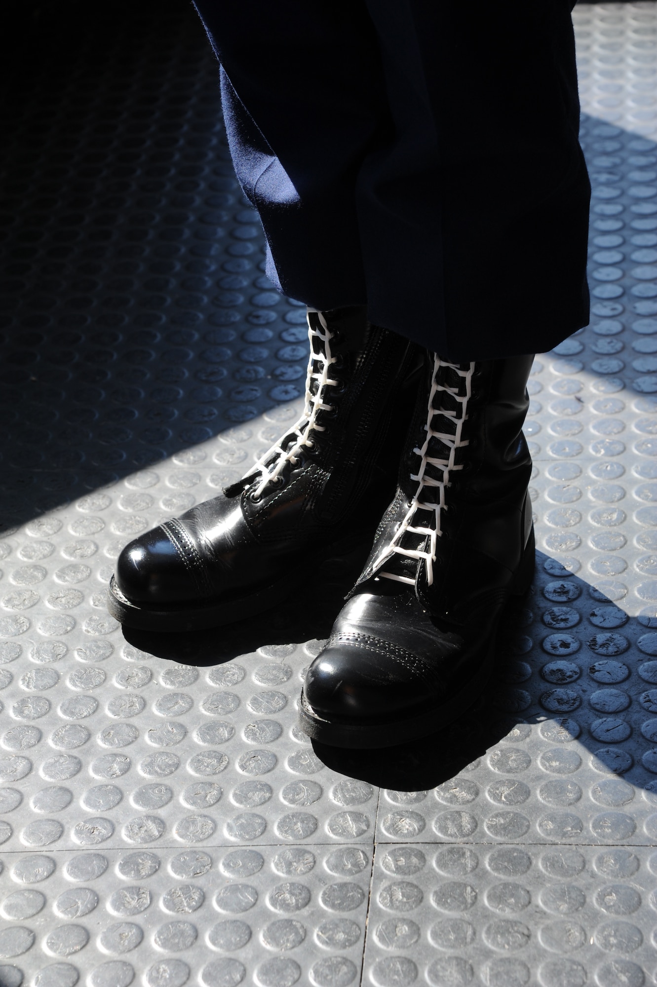 The 81st Security Forces Squadron elite gate guards wear black boots with white shoe strings as a part of their elite uniforms at Keesler Air Force Base, Miss. Keesler is the only base in Air Education and Training Command to adopt an elite gate guard program. The program increases pride and discipline within the 81st SFS while creating a positive, lasting impression in the local community. (U.S. Air Force photo by Kemberly Groue)