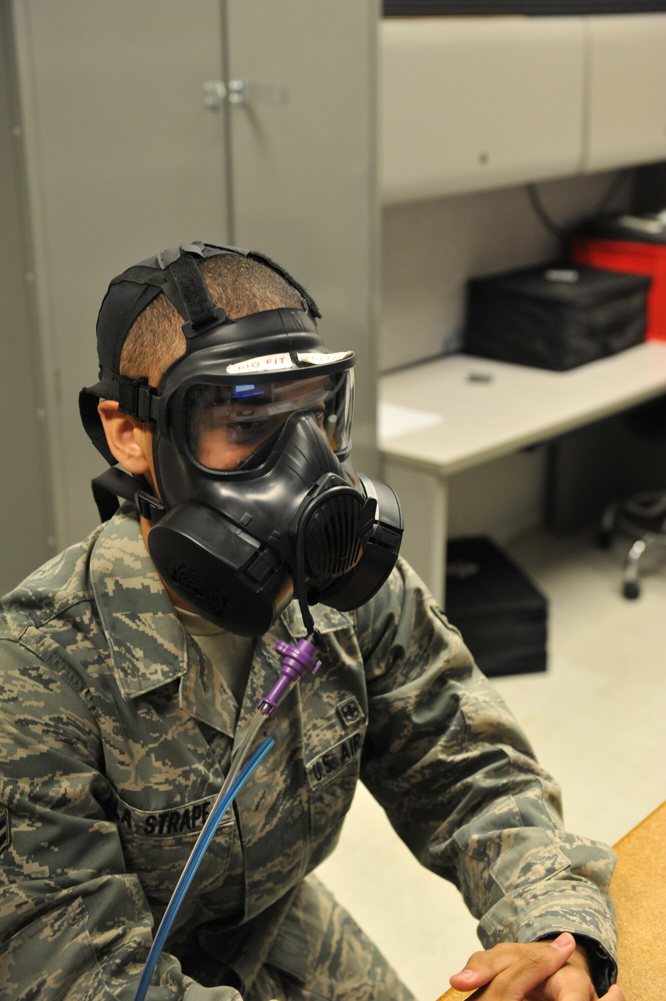 WHITEMAN AIR FORCE BASE, Mo. -- Airman 1st Class Lawrence La Strape, 509th Medical Operations Squadron Bioenvironmental Engineer takes a gas mask fit test at the Bioenvironmental Center Oct. 3, 2012. Airmen of the 509th MDOS ensure the safety of the base by testing the air, water and soil. (U.S. Air Force photo/Heidi Hunt) (Released)