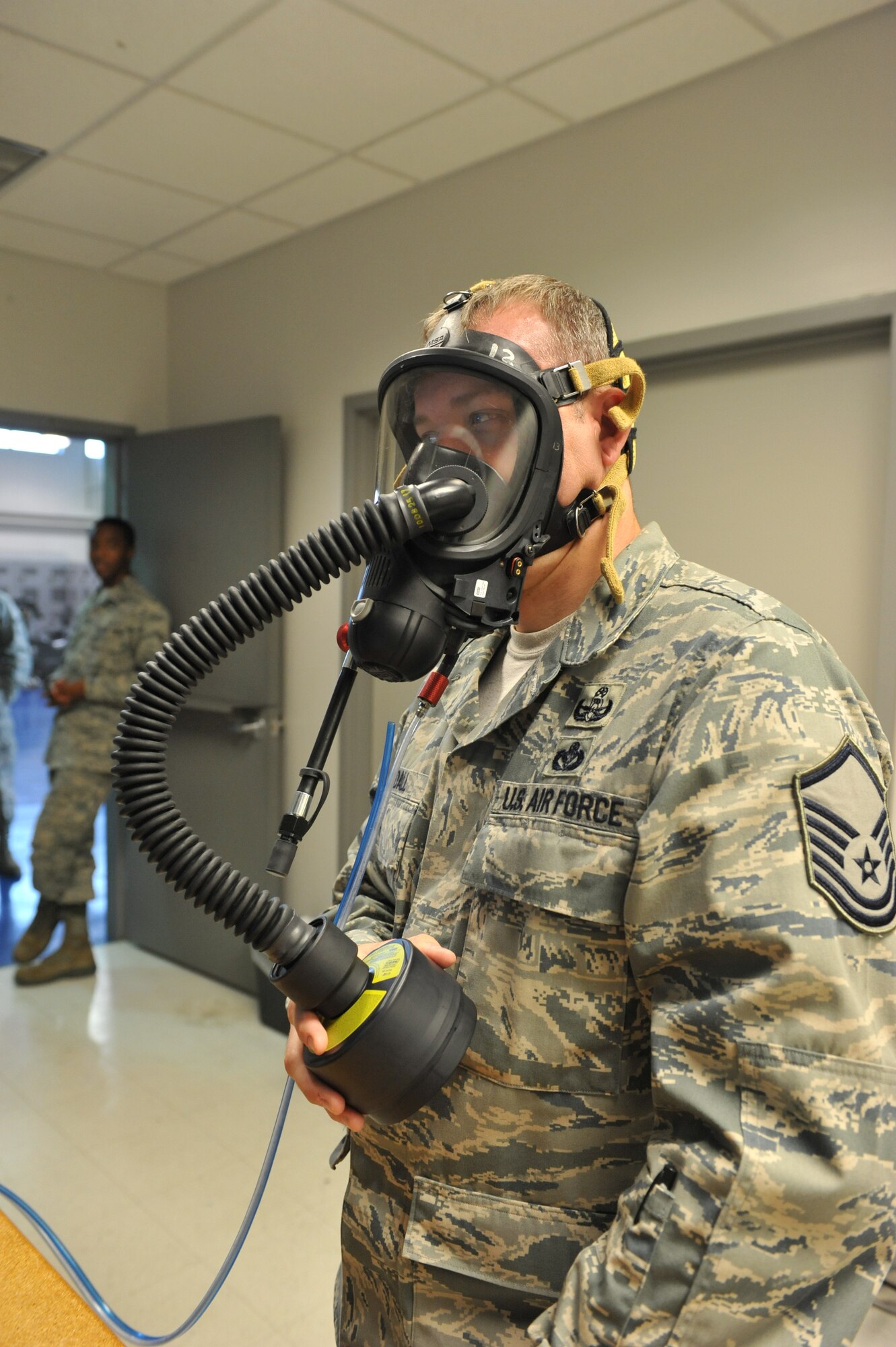 Master Sgt. Robert Randall, 509th Civil Engineer Squadron, takes a gas mask fit test at the 509th Medical Operations Squadron Bioenvironmental Center at Whiteman Air Force Base, Mo., Oct. 3, 2012. Bioenvironmental not only performs fit tests, but also water samples, noise assessments, air sampling and health risk assessments. (U.S. Air Force photo/Heidi Hunt) (Released) 