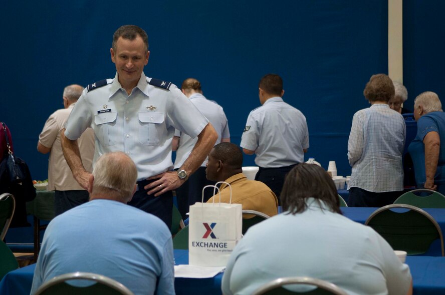 U.S. Air Force Col. Billy Thompson, 23d Wing commander speaks with retirees during Retiree Appreciation Day at Moody Air Force Base, Ga., Oct. 6, 2012. Members from different agencies and organizations set up displays and provided information on health and finance for the day. (U.S. Air Force photo by Airman 1st Class Paul Francis/Released)