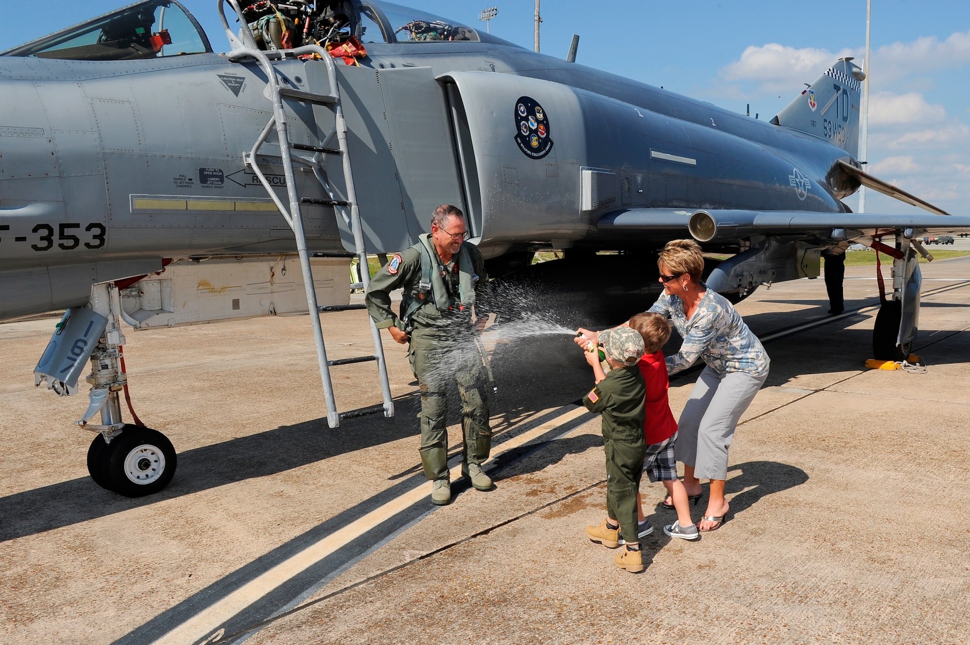 Grandsons of Matthew LaCourse, 82nd Aerial Targets Squadron pilot/controller, Brody Brechtel (4) and Lincoln LaCourse (4) and his wife, Tina, celebrate his 2,000 hour milestone in the F-4 Phantom. (U.S. Air Force photo by Lisa Norman) 