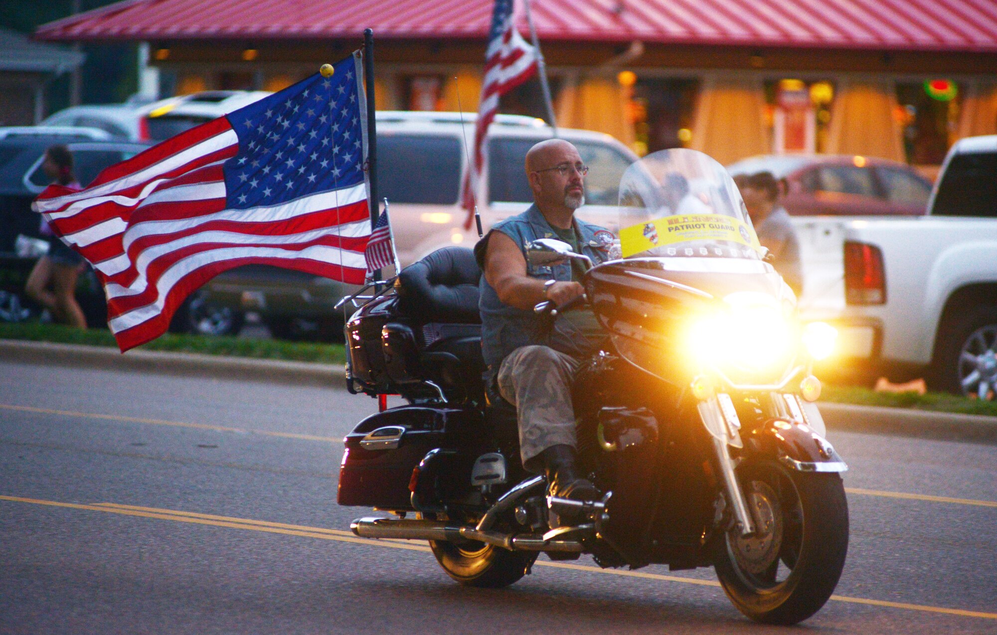 A member of the Patriot Guard organization escorts the traveling memorial into O'Fallon, Ill., Oct. 4. The Patriot Guard delivered the memorial while 150 riders from Vander Clute, Band of Brothers and Green Knights motorcycle clubs lead the expedition. (U.S. Air Force photo/Staff Sgt. Ryan Crane)