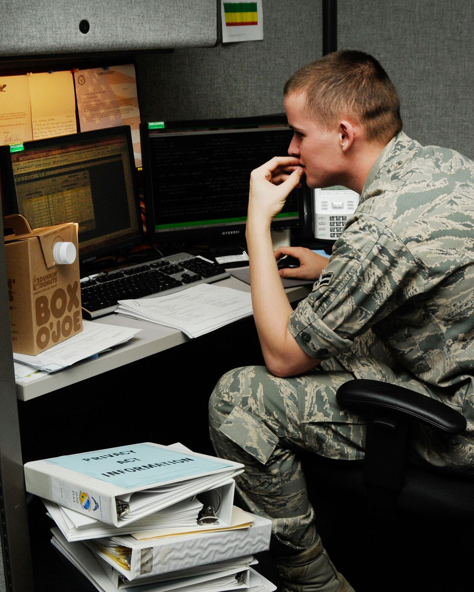 HANSCOM AIR FORCE BASE , Mass.-- Airman 1st Class Matthew Goforth,  66th Comptroller Squadron accounting technician, reviews last minute figures for end of the year finances Sept. 28. CPTS members pulled long hours during fiscal year 2012 closeout. (U.S. Air Force photo by Linda LaBonte Britt)