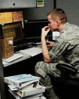 HANSCOM AIR FORCE BASE , Mass.-- Airman 1st Class Matthew Goforth,  66th Comptroller Squadron accounting technician, reviews last minute figures for end of the year finances Sept. 28. CPTS members pulled long hours during fiscal year 2012 closeout. (U.S. Air Force photo by Linda LaBonte Britt)