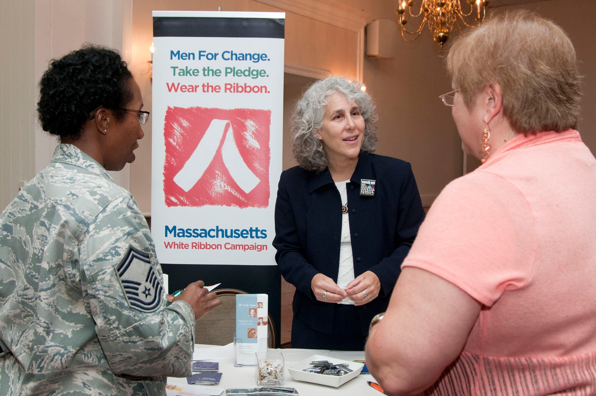 HANSCOM AIR FORCE BASE, Mass. - Toni Troop, Jane Doe Inc. Development and Public Relations director, speaks with Senior Master Sgt. Lynette Scott, 66th Comptroller Squadron superintendent, and Denise Beaudry, 66th Air Base Group Commander's Action Office chief, about Jane Doe Inc. during a Combined Federal Campaign Benefit Fair at the Minuteman Commons Oct. 3. Numerous organizations were on hand for base employees to learn more about CFC and ways to give to a local charity. (U.S. Air Force Base photo by Mark Wyatt)