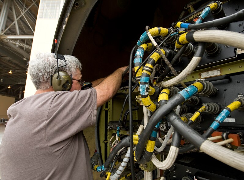 Tech. Sgt. Ken Woolley, 307th Aircraft Maintenance Squadron Active Reserve technician, connects cables under the nose cone of a B-52H Stratofortress while running an electronic countermeasures test on Barksdale Air Force Base, La., Oct. 10. The test, which takes several days to complete, ensures that all ECM components on the aircraft are working properly and can defend the plane if it were to be engaged by the enemy. (U.S. Air Force photo/Staff Sgt. Chad Warren)(RELEASED)