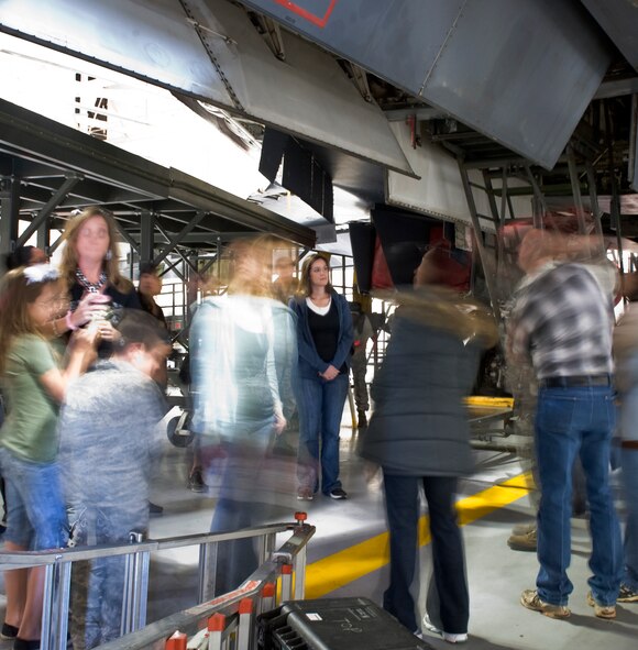 Friends and family of 7th Component Maintenance Squadron Airmen look underneath a B-1 Bomber Oct. 10, 2012, at Dyess Air Force Base, Texas. The 7th CMS Friends and Family Day allowed the Airmen’s significant others a chance to see what it takes to keep the B-1 and C-130J in the air. (U.S. Air Force photo by Airman 1st Class Jonathan Stefanko)