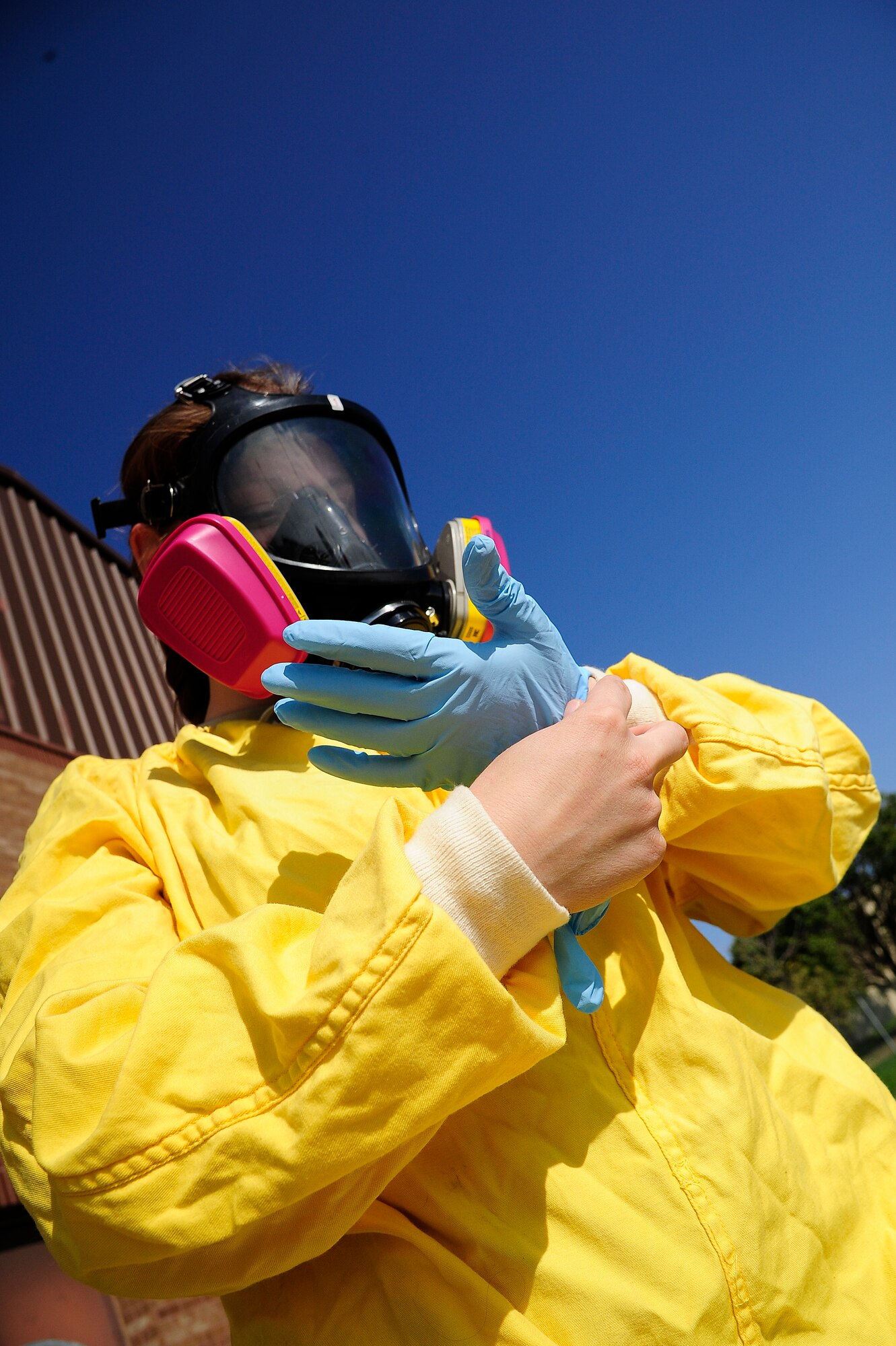 Staff Sgt. Aimee Stark, 509th Medical Operations Squadron bioenvironmental engineer, covers her body from head to toe during a practice radiation reading at Whiteman Air Force Base, Mo., Oct. 3. Stark's protective gear, a respirator and Anti-C Suit, can block alpha and most beta rays. (U.S. Air Force photo/Senior Airman Cody H. Ramirez)(RELEASED)