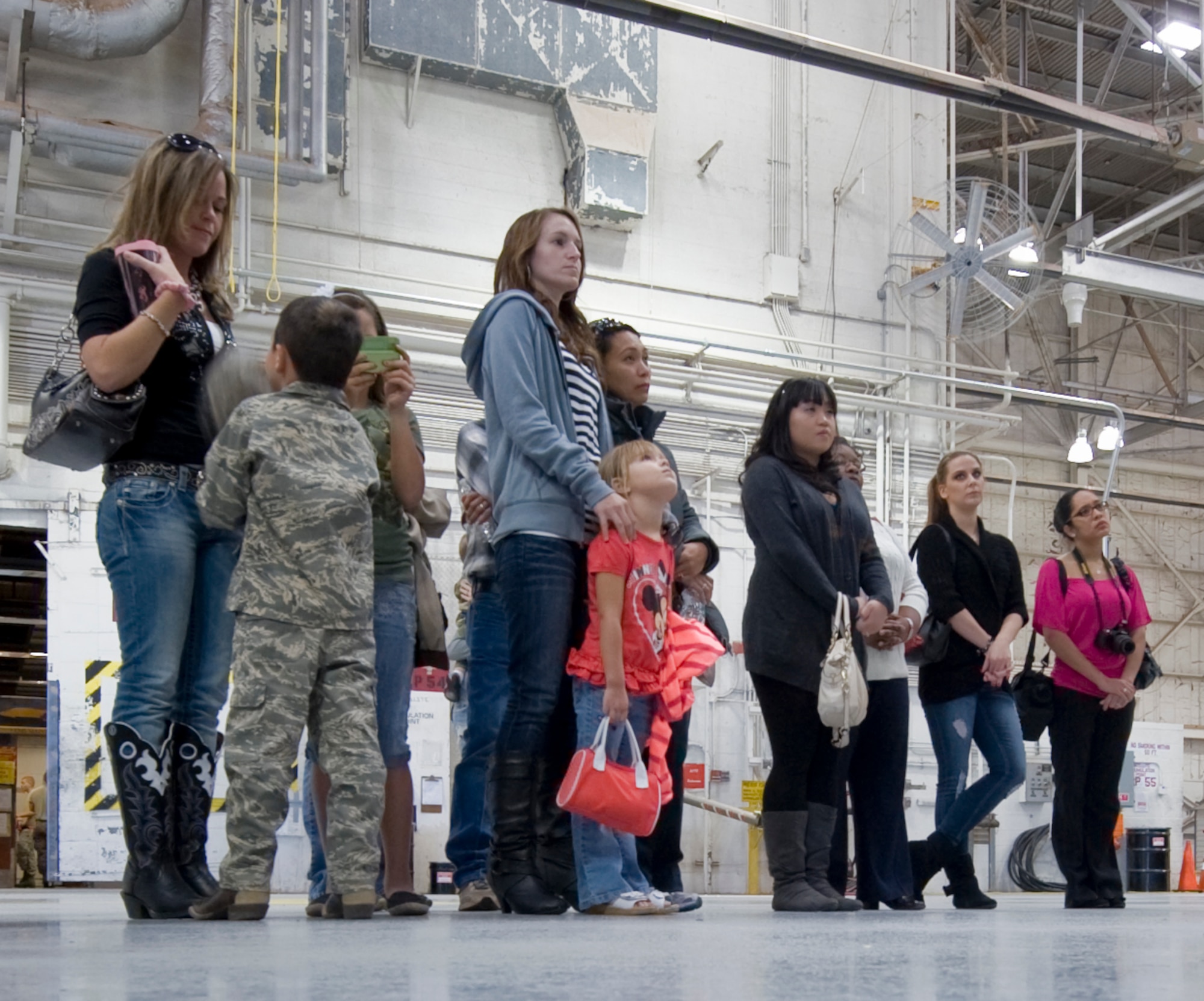 An Airman from the 7th Component Maintenance Squadron explains his role during a 7th CMS Friends and Family Day Oct. 10, 2012, at Dyess Air Force Base, Texas. The 7th CMS Friends and Family Day allowed the Airmen’s significant others a chance to see what it takes to keep the B-1 and C-130J in the air. (U.S. Air Force photo by Airman 1st Class Jonathan Stefanko)