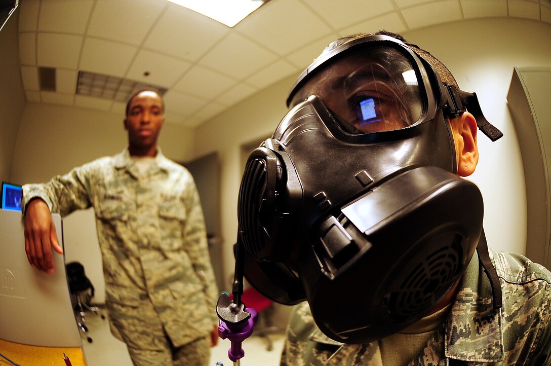 Airman 1st Class Lawrence La Strape watches his rates of breathing on a computer monitor during a fit test at Whiteman Air Force Base, Mo., Oct. 3. La Strape was monitored by Airman 1st Class Joseph Flowers, 509th Medical Operations Squadron bioenvironmental engineer, who ensured breathing rates were within acceptable ranges. (U.S. Air Force photo/Senior Airman Cody H. Ramirez)(RELEASED)