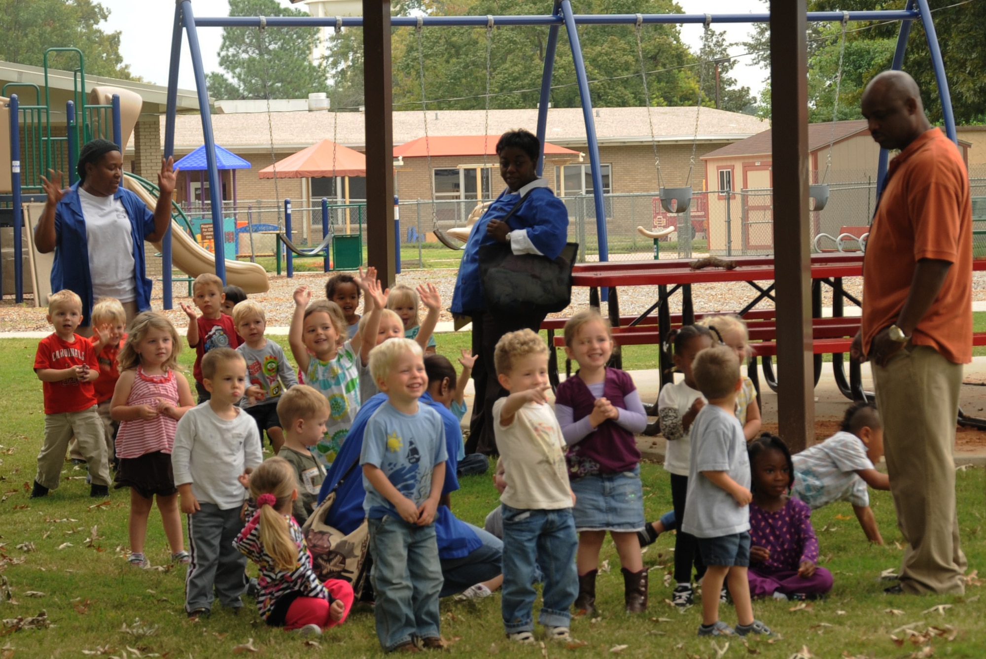 Children wave goodbye to Sparky the fire dog during a monthly fire drill at the Child Development Center on Barksdale Air Force Base, La., Oct. 10. The fire drill was conducted as part of Fire Prevention Week which takes place Oct. 7 to 13. The purpose of Fire Prevention Week is to inform the Barksdale community on fire safety and useful fire prevention tips. (U.S. Air Force photo/Senior Airman Sean Martin) (RELEASED)