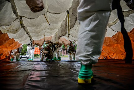Airmen from the 628th Medical Group, erect a decontamination tent during a mass casualty exercise Oct. 3, 2012, at Joint Base Charleston - Air Base, S.C. During the exercise, the 628th MDG set up a cordon, secured the contaminated area and provided emergency medical treatment to simulated casualties. The training prepares Airmen to respond to a chemical, biological, radiological or nuclear catastrophe.  (U.S. Air Force photo/Staff Sgt. Rasheen Douglas)
