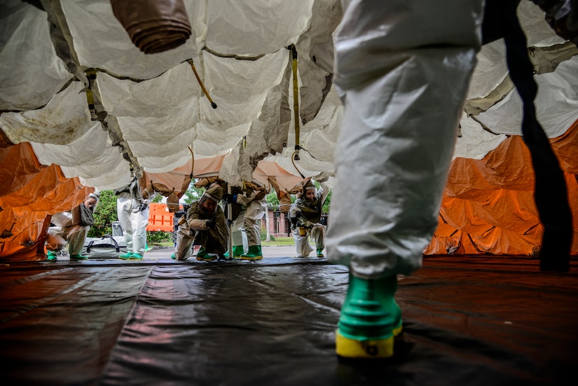 Airmen from the 628th Medical Group, erect a decontamination tent during a mass casualty exercise Oct. 3, 2012, at Joint Base Charleston - Air Base, S.C. During the exercise, the 628th MDG set up a cordon, secured the contaminated area and provided emergency medical treatment to simulated casualties. The training prepares Airmen to respond to a chemical, biological, radiological or nuclear catastrophe.  (U.S. Air Force photo/Staff Sgt. Rasheen Douglas)