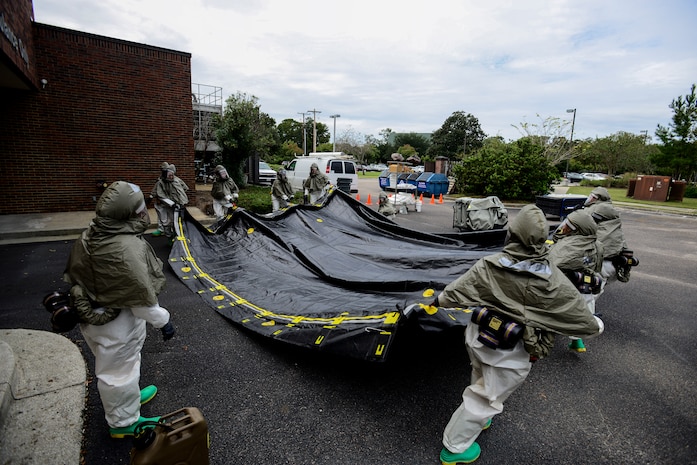 Airmen from the 628th Medical Group, set up the floor of a decontamination tent during a mass casualty exercise Oct. 3, 2012, at Joint Base Charleston - Air Base, S.C. The training prepares Airmen to respond to a chemical, biological, radiological or nuclear catastrophe. (U.S. Air Force photo/Staff Sgt. Rasheen Douglas)