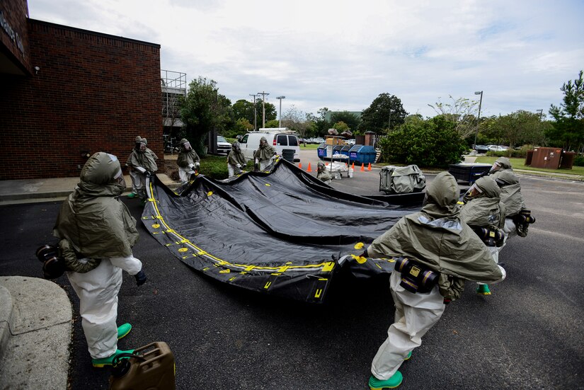Airmen from the 628th Medical Group, set up the floor of a decontamination tent during a mass casualty exercise Oct. 3, 2012, at Joint Base Charleston - Air Base, S.C. The training prepares Airmen to respond to a chemical, biological, radiological or nuclear catastrophe. (U.S. Air Force photo/Staff Sgt. Rasheen Douglas)