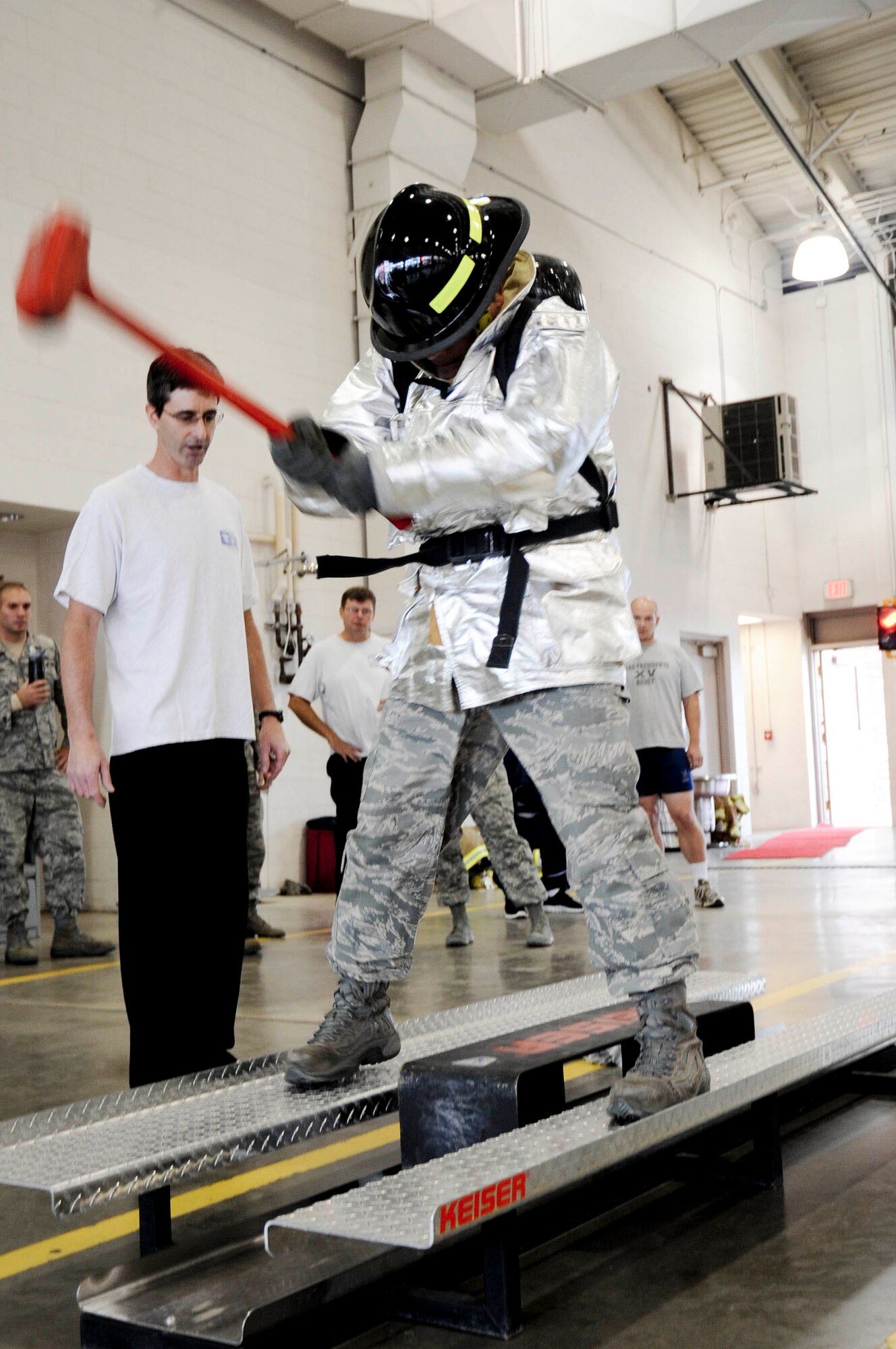 Col. Thomas Goulter, 28th Mission Support Group commander, swings a sledgehammer on the Keiser Sled during the Firefighter Challenge at the fire station at Ellsworth Air Force Base, S.D., Oct. 5, 2012. Sixteen teams competed in a variety of modified activities firefighters routinely perform when responding to emergency situations. (U.S. Air Force photo by Airman 1st Class Anania Tekurio/Released)