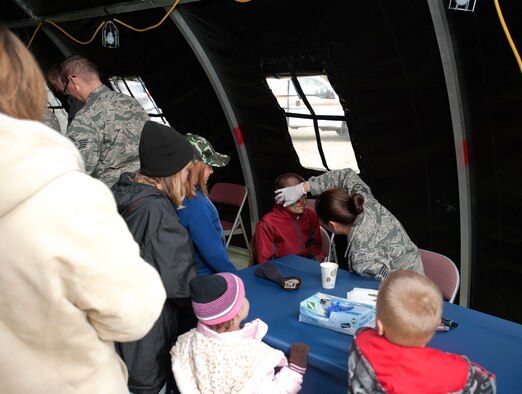 Children of McConnell Airmen get their faces painted during the Family Mobility Line Oct. 6, 2012, McConnell Air Force Base, Kan. The event, which simulated a deployment, is an annual event hosted by the Airman and Family Readiness Center. (U.S. Air Force photo/Airman 1st Class Victor J. Caputo)