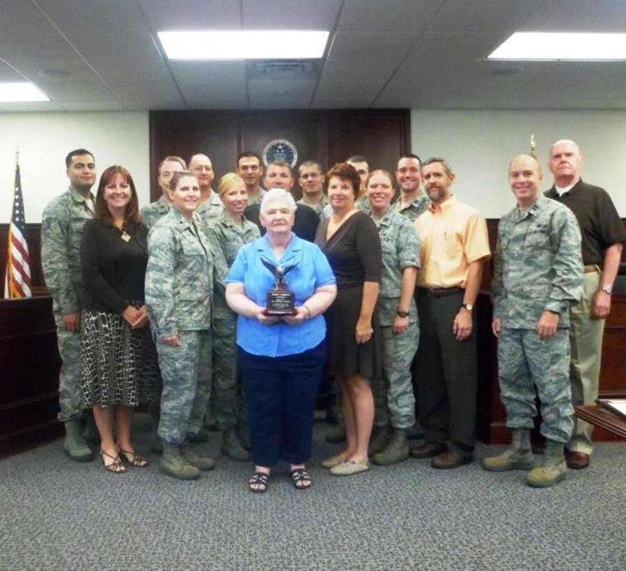 Last month volunteer LaVonne Swank, a retired military spouse, was
awarded a 2500 hour achievement award.  Ms. Swank has been a Project
Emeritus volunteer since April 2004.  In the past, she has worked as a
income tax return preparer, a military ID office volunteer and most recently
in the Judge Advocate General's office.  In the attached photos she is being
honored with her 2500 hr eagle statuette by the 45th Space Wing Judge Advocate office staff.  
