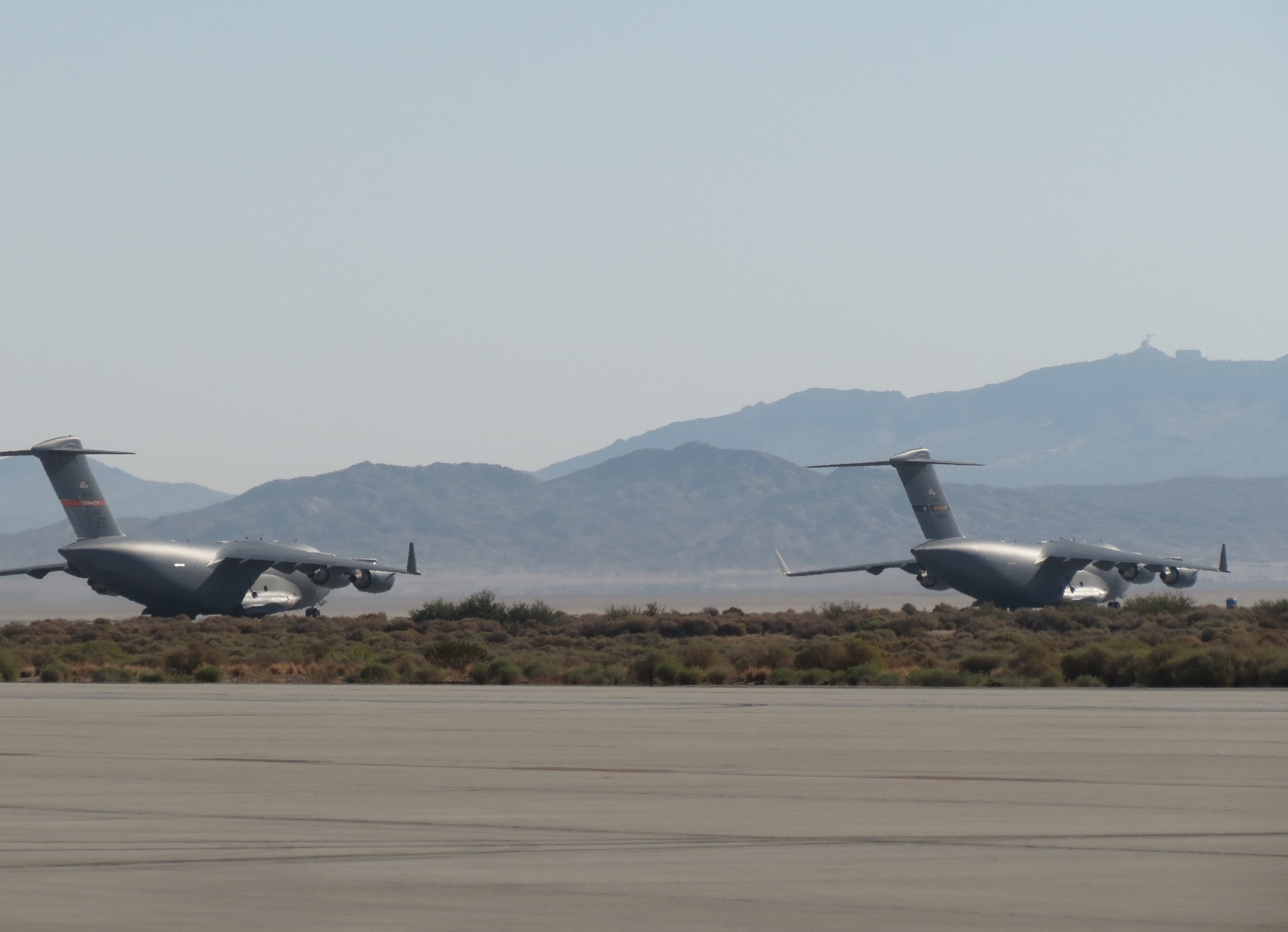 The first C-17 flight tests employing “vortex surfing” were conducted at Edwards Air Force Base, Calif., Sept. 6 and Oct. 2.  Surfing Aircraft Vortices for Energy, or $AVE, involves two or more aircraft flying together for a reduced drag effect to save fuel. (Courtesy photo)