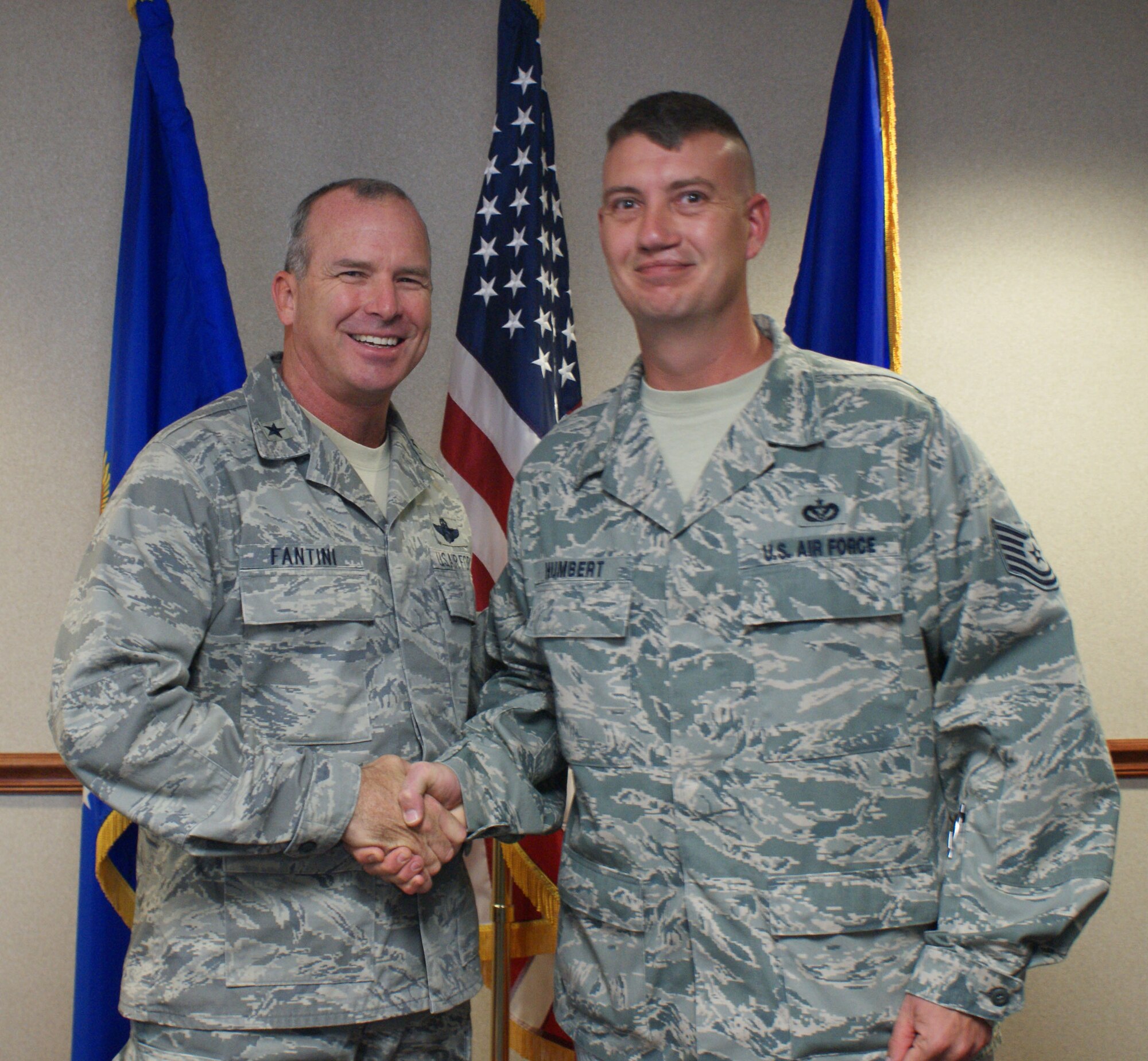 Brig. Gen. Michael Fantini (left), 82nd Training Wing commander, congratulates Tech. Sgt. Dustin Humbert, 366th Training Squadron, for being named the "Commander's Wingman of Choice" for Oct. 8-12.  The award is given weekly to highlight the outstanding contributions members of Team Sheppard make both on duty and in the community.