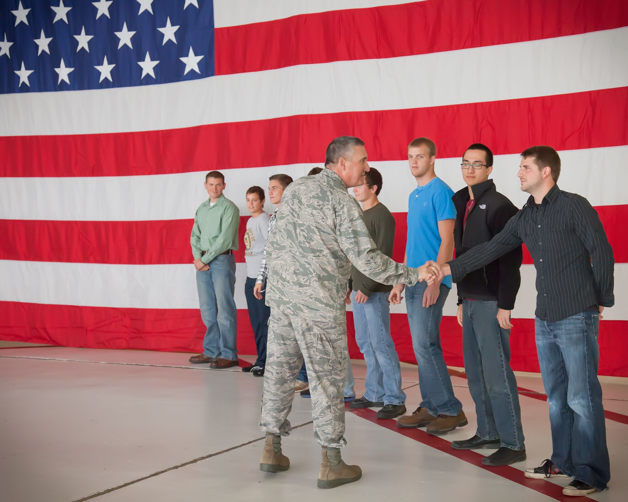 Col. Darrell Young, Commander of the 934th Airlift Wing, congratulates new recruits after taking the oath of enlistment Oct. 9 at the Minneapolis-St. Paul Air Reserve Station, Minn. (U.S. Air Force Photo/Shannon McKay)