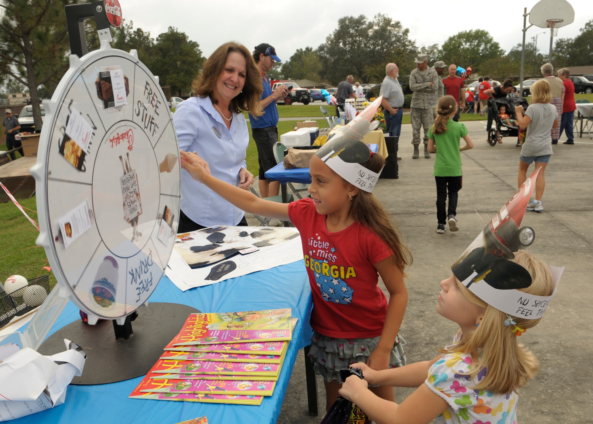 Moody family housing residents spin for free chicken at a booth during National  Night Out at Moody Air Force Base, Ga., Oct. 4, 2012. NNO was designed to help raise awareness against crime, and gathered Team Moody in a fun and safe environment. (U.S. Air Force photo by Senior Airman Eileen Meier/Released) 