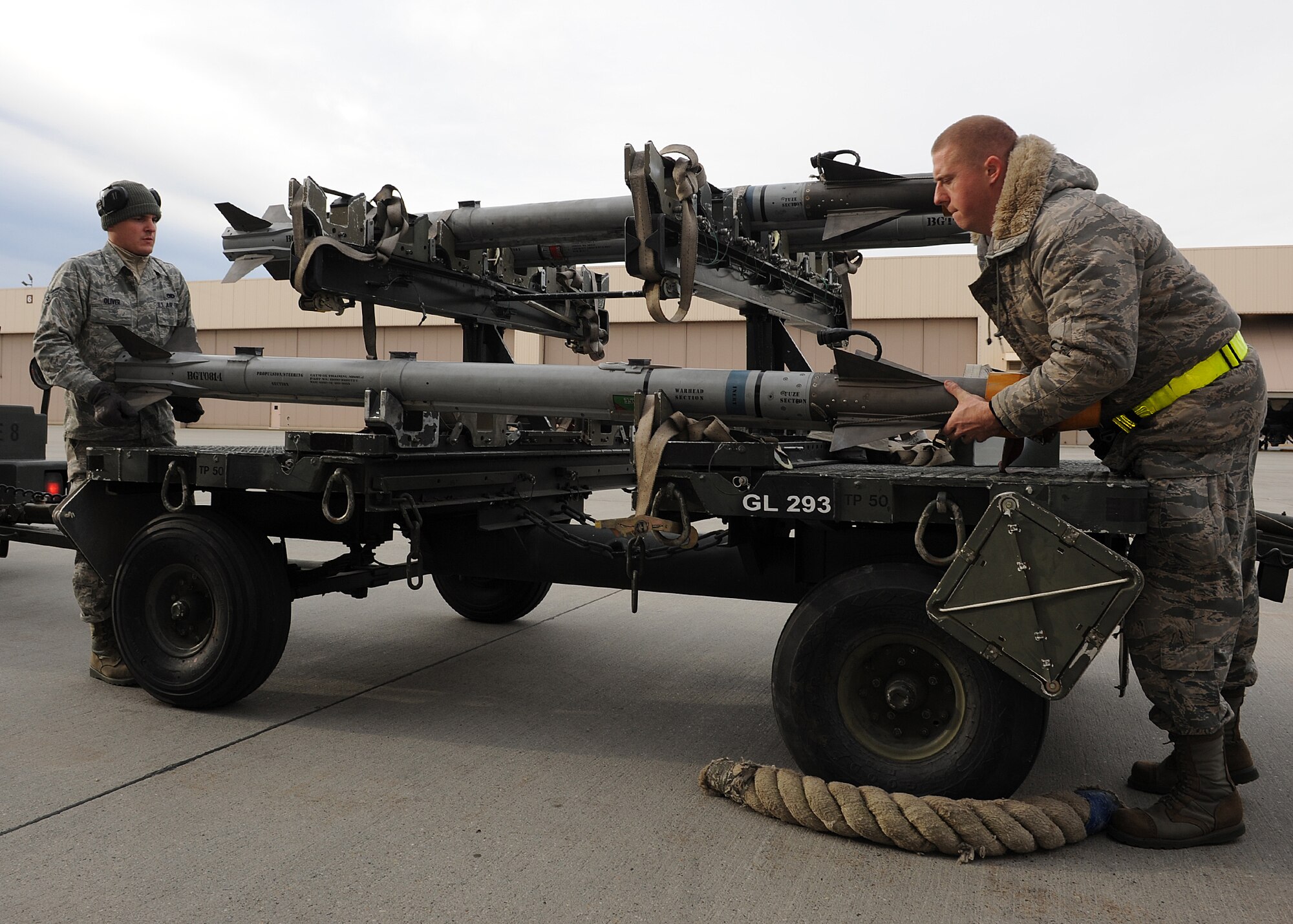 Senior Airman Brandon Oliver, left, and Staff Sgt. Joshua Chapman, both 8th Maintenance Operations Squadron, Kunsan Air Base, Republic of Korea, prepare to load a missile onto an F-16 Fighting Falcon on Eielson Air Force Base, Alaska, Oct. 5, 2012. This was part of Red Flag-Alaska, an exercise testing the combat and mission capabilities of aircraft and personnel from around the Air Force. (U.S. Air Force photo/Staff Sgt. Jonathan Fowler)