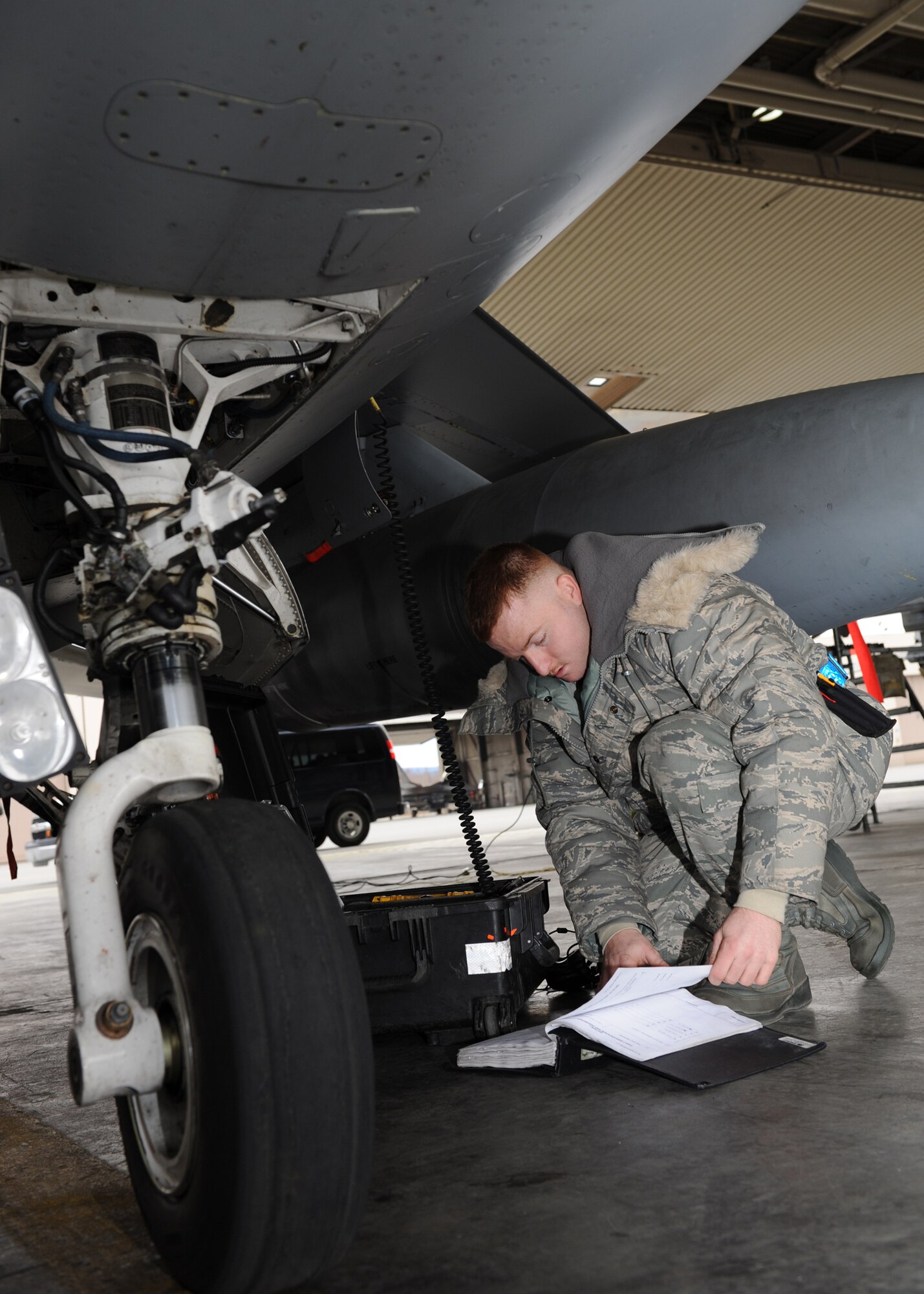 Staff Sgt. Justin Thomas, 8th Aircraft Maintenance Squadron, Kunsan Air Base, Republic of Korea, downloads engine data from an F-16 Fighting Falcon following a mission during Red Flag-Alaska on Eielson Air Force Base, Alaska, Oct. 5, 2012. This is one of many post-flight operations performed to ensure the aircraft is running well. (U.S. Air Force photo/Staff Sgt. Jonathan Fowler)